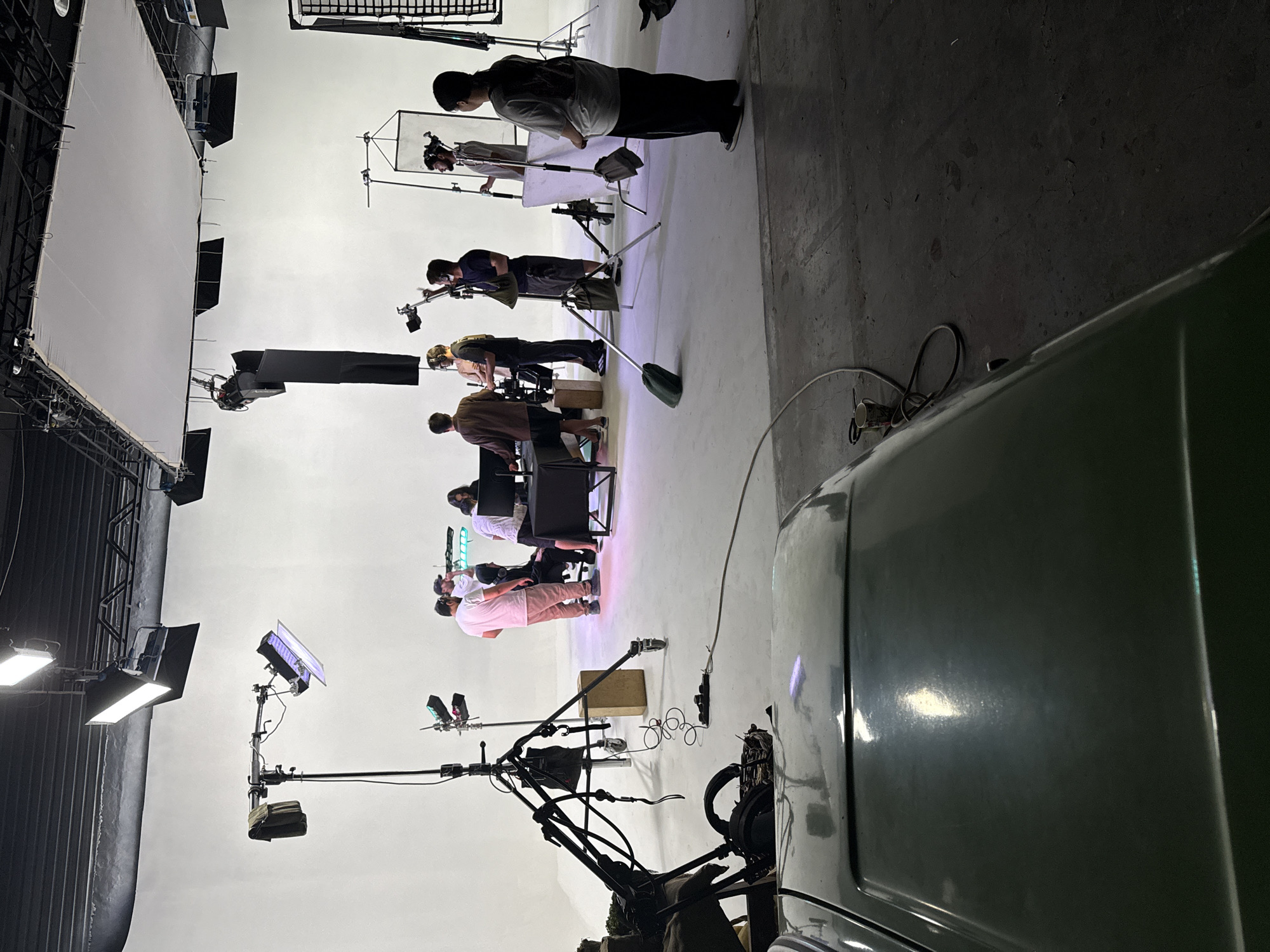 Studio production underway in Tashkent with crew and white backdrop