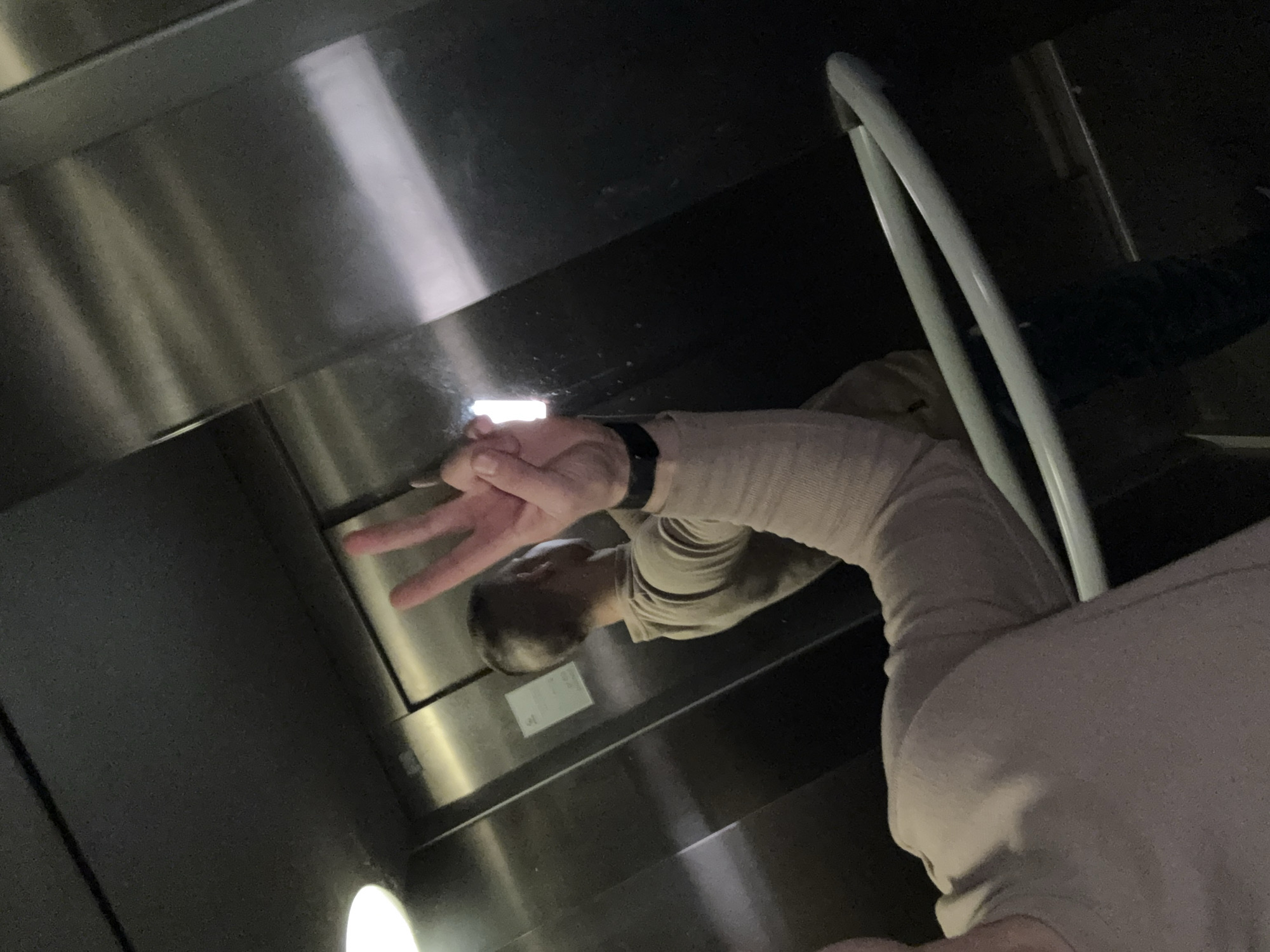 Man poses with peace sign in Sofia elevator