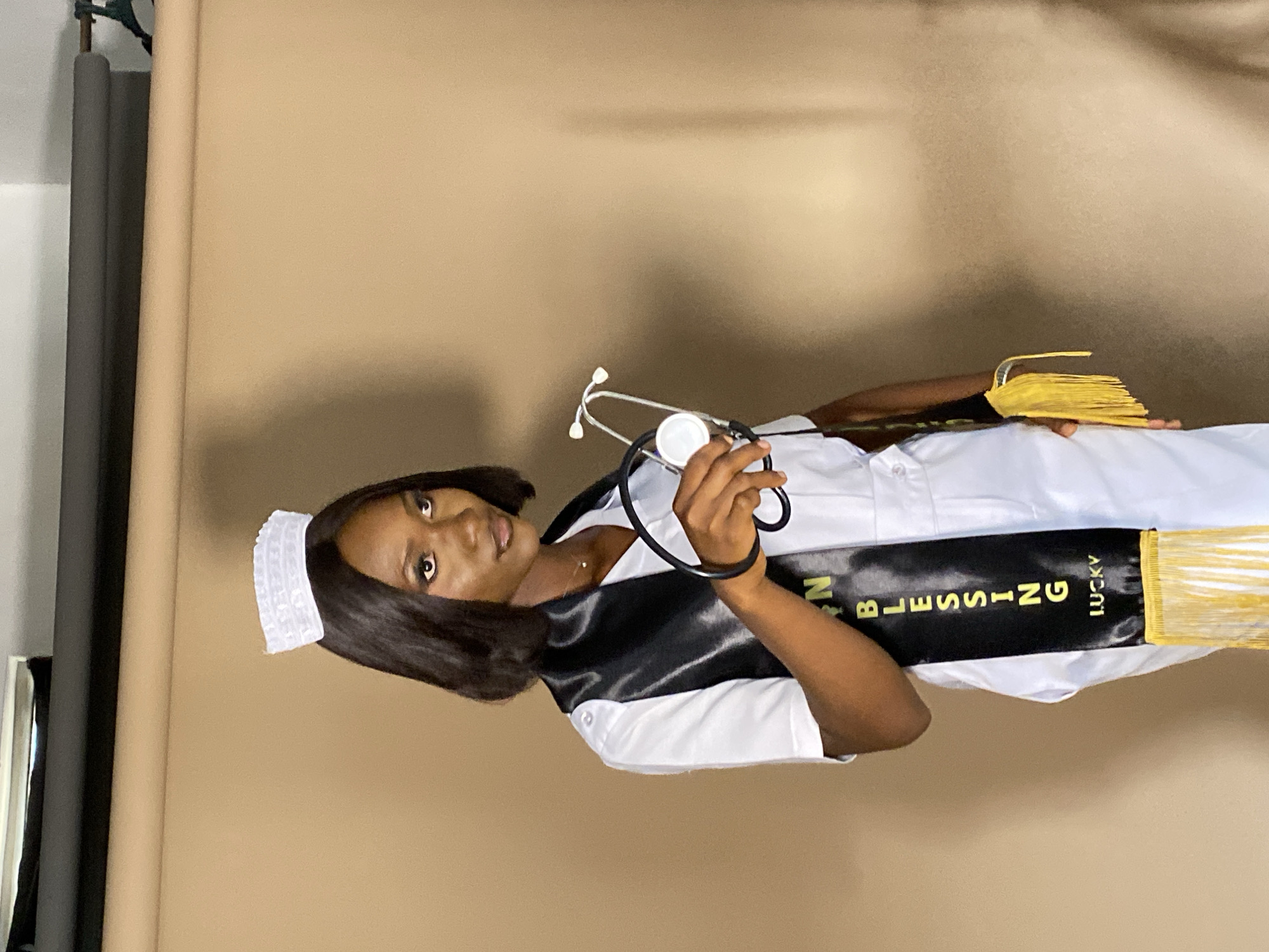 Nurse poses for studio portrait in Nigeria