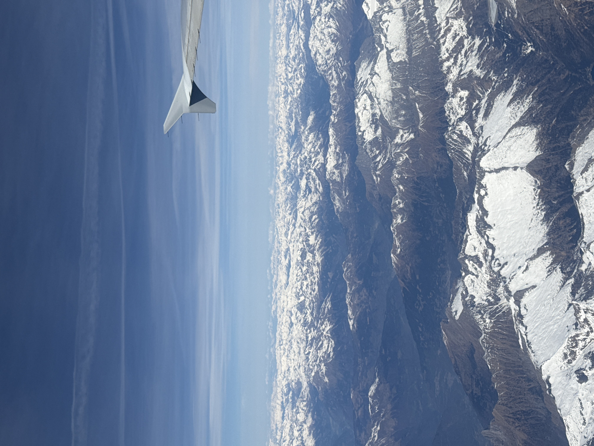 Aircraft passenger captures snowy mountain view over Austria