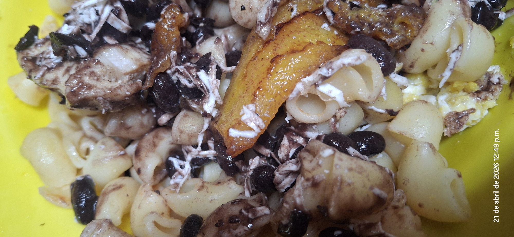 Mixed pasta dish with beans, cheese, plantains documented