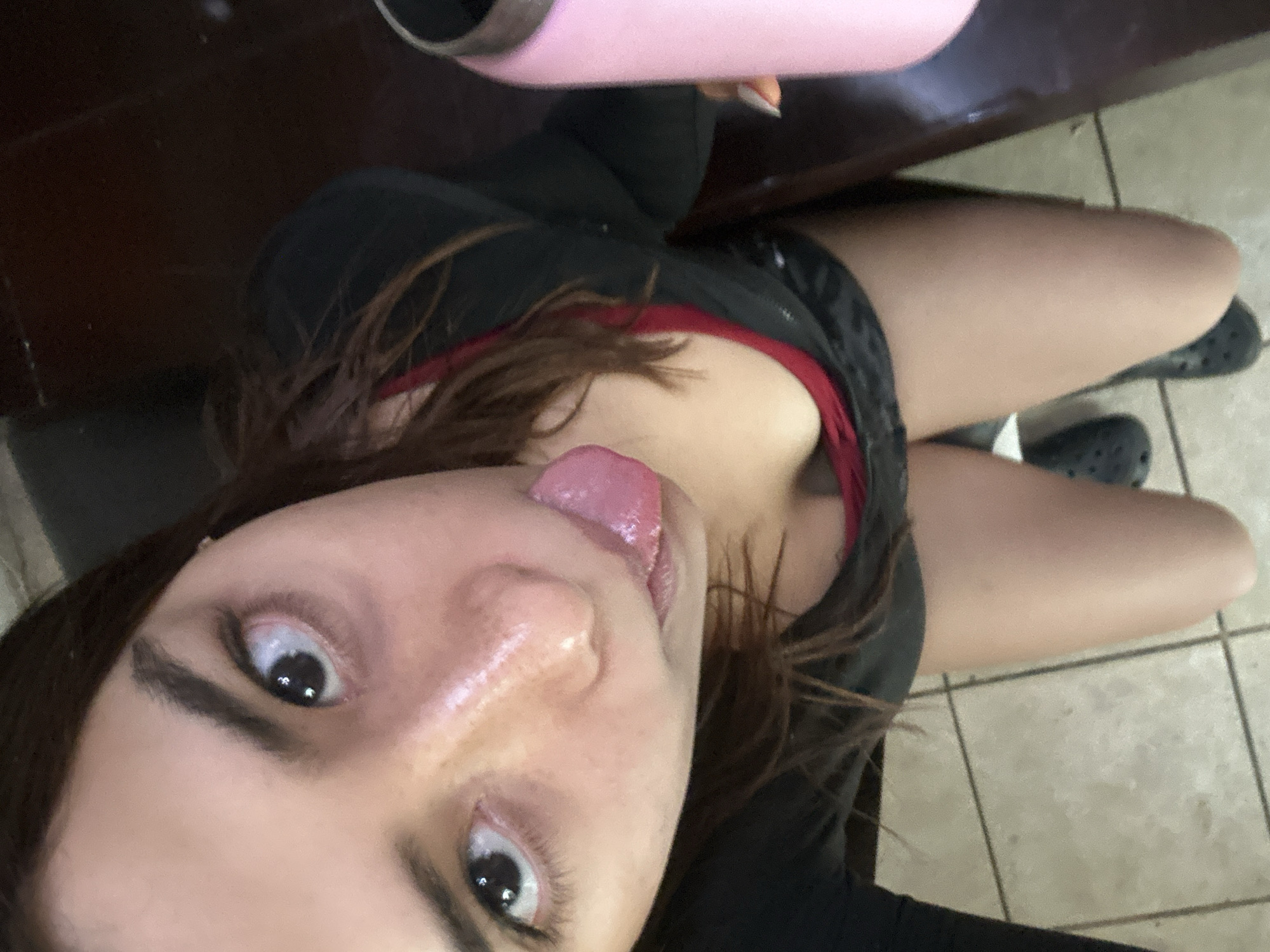 Woman takes selfies in bedroom in Puebla, Mexico