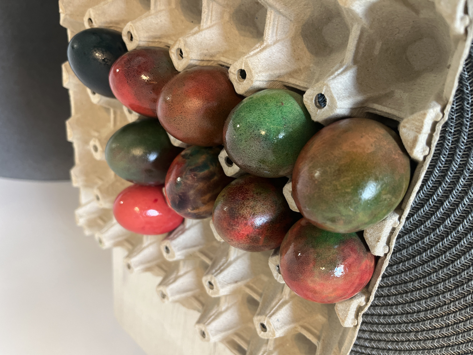Colorful dyed eggs displayed in carton in Sofia