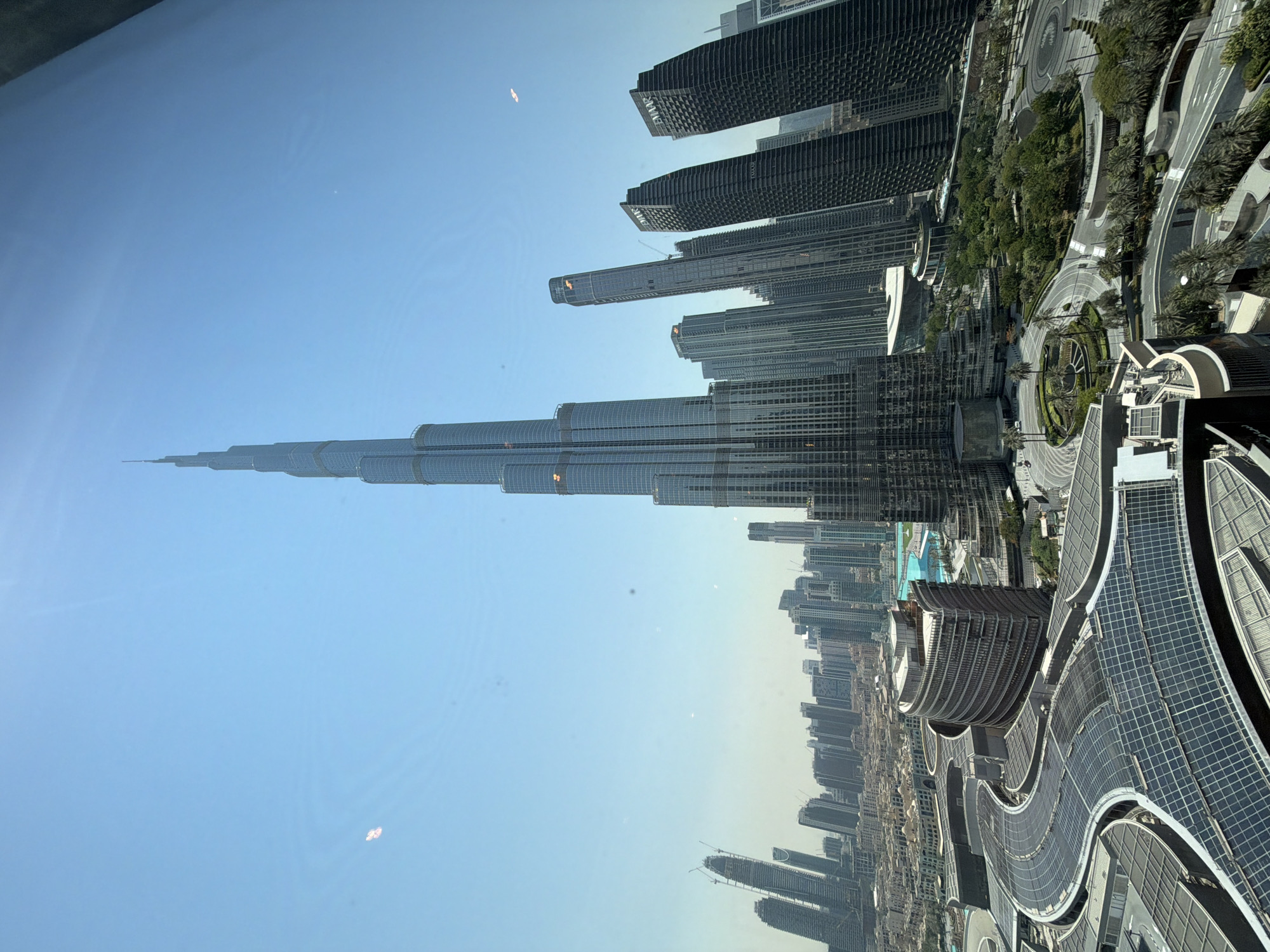 Bird's-eye sweep of Dubai's Burj Khalifa district from above