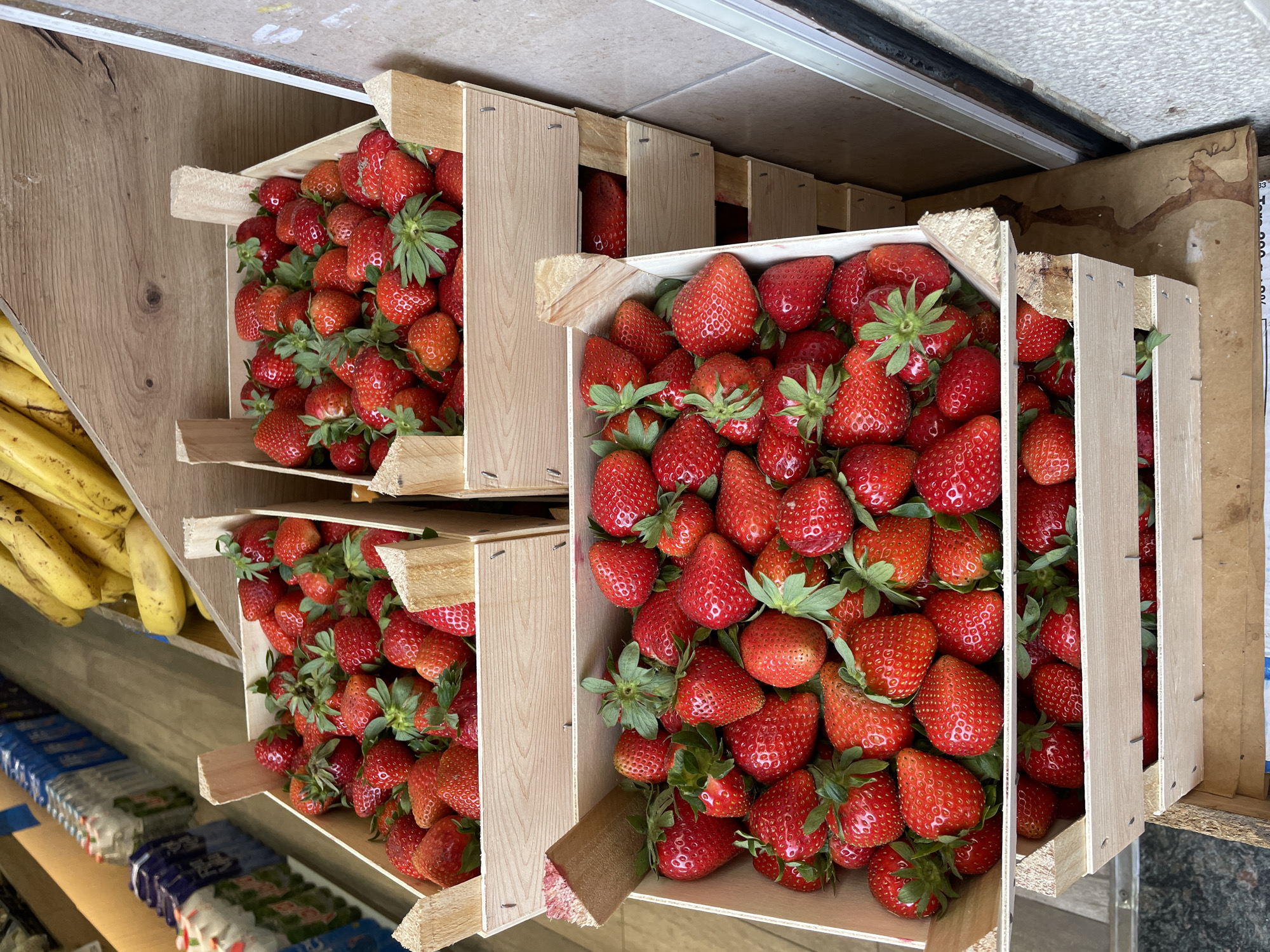 Strawberry crates displayed at Barcelona produce stand