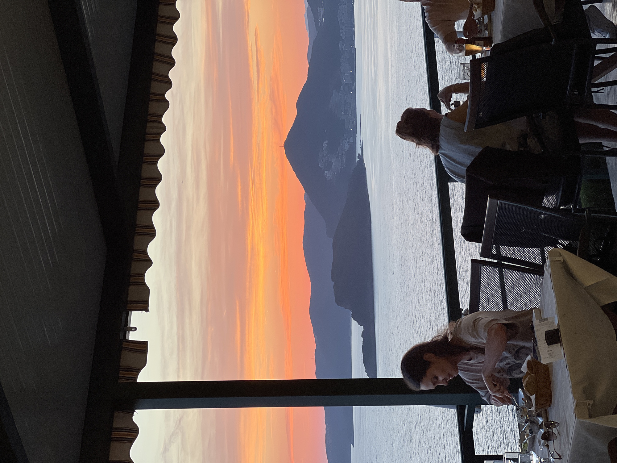 Evening diners enjoy sunset meal at Sveti Stefan restaurant