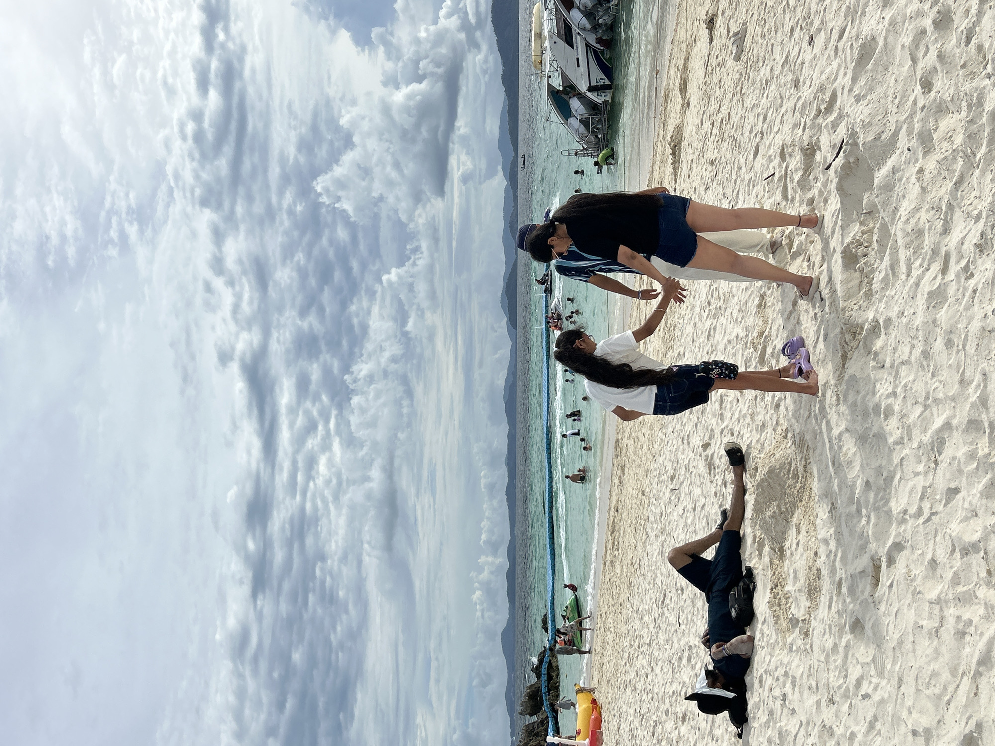 Busy tropical beach morning in Tambon Phru Nai, Phuket