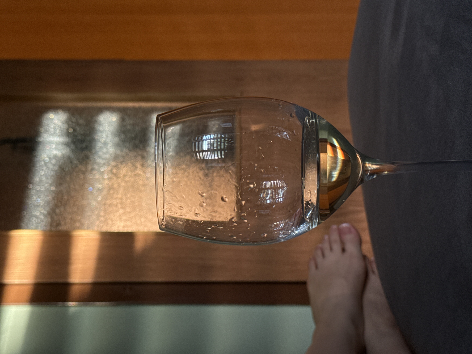 Person experiments with inverted wine glasses in Bratislava residence