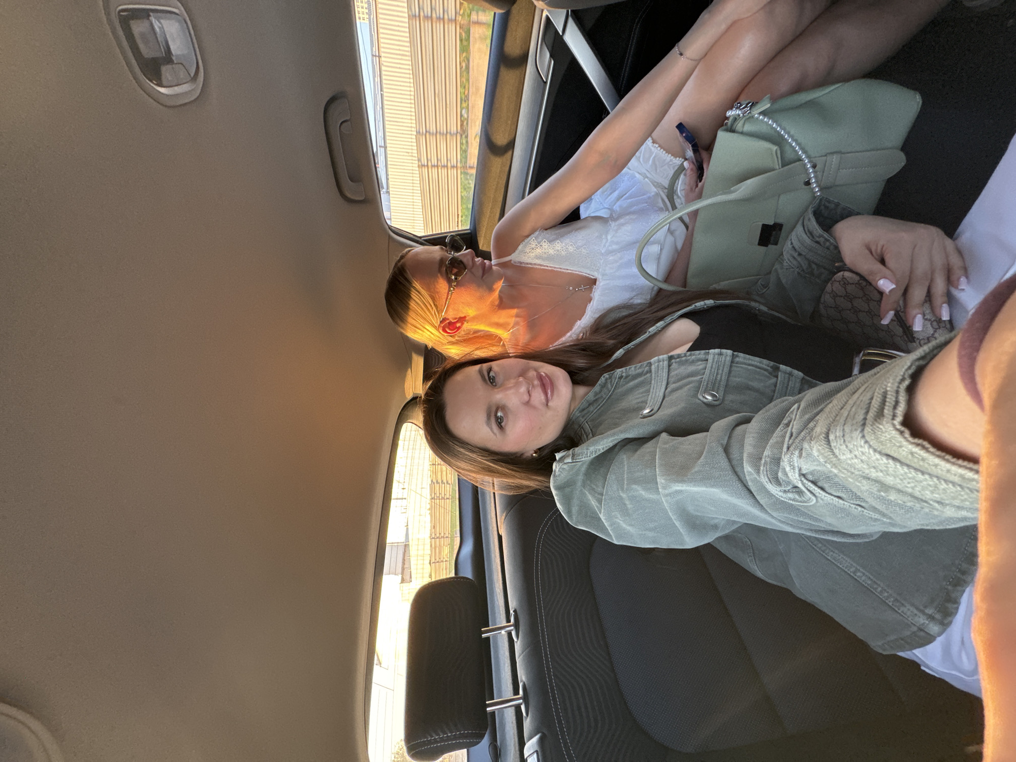 Two women photographed together in car in Odintsovo