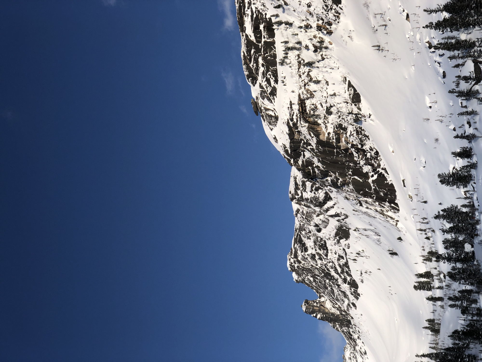 Snow-covered Russian mountains documented under clear blue skies