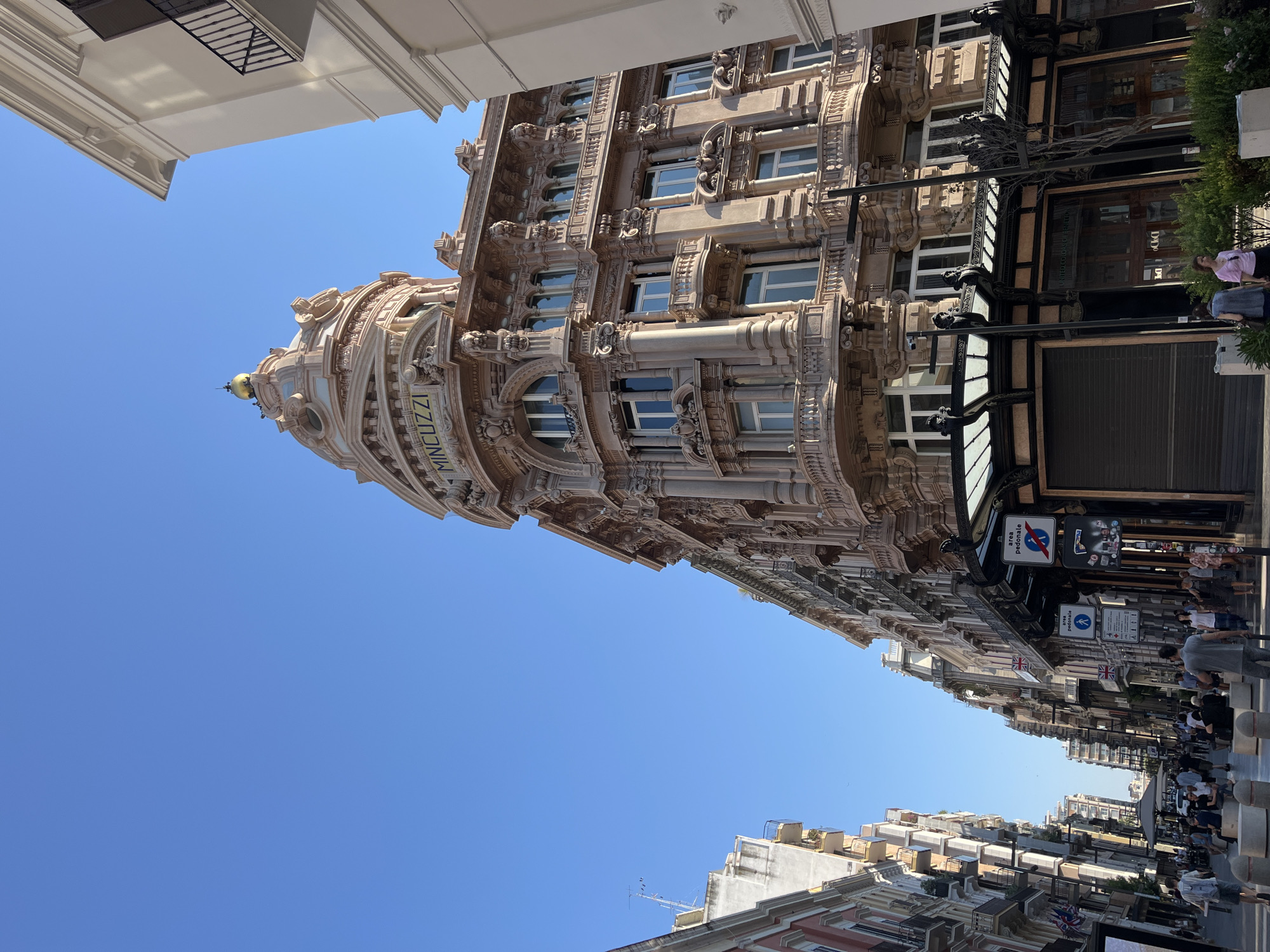 City streets and a Victoria's Secret stop, sunny urban day.