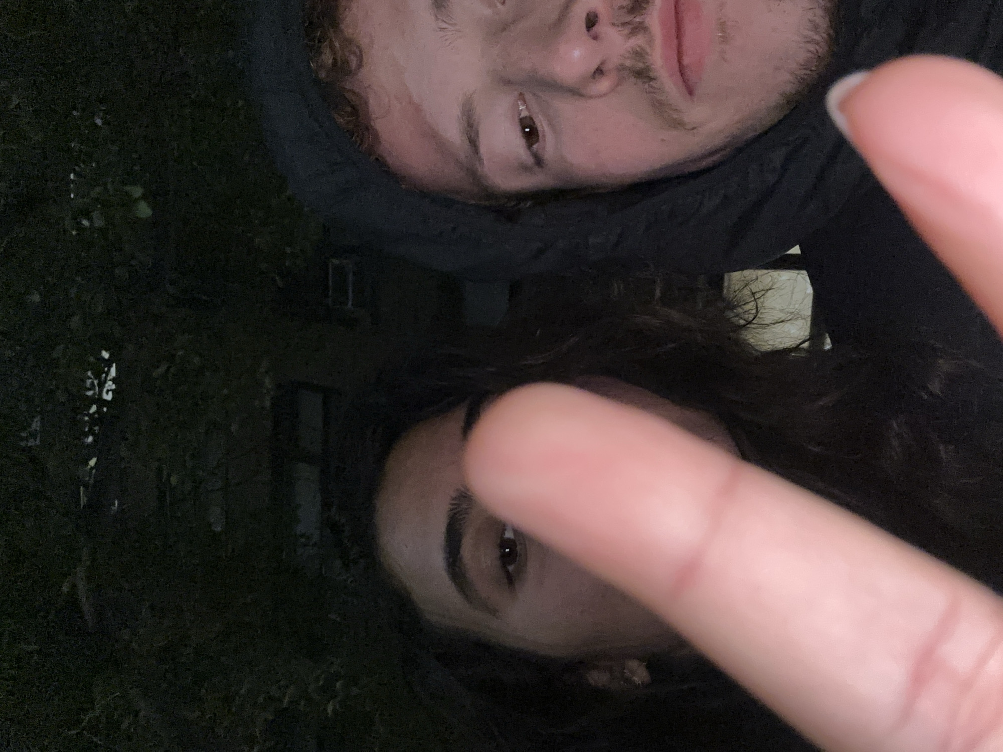 Two people take nighttime selfie in New York