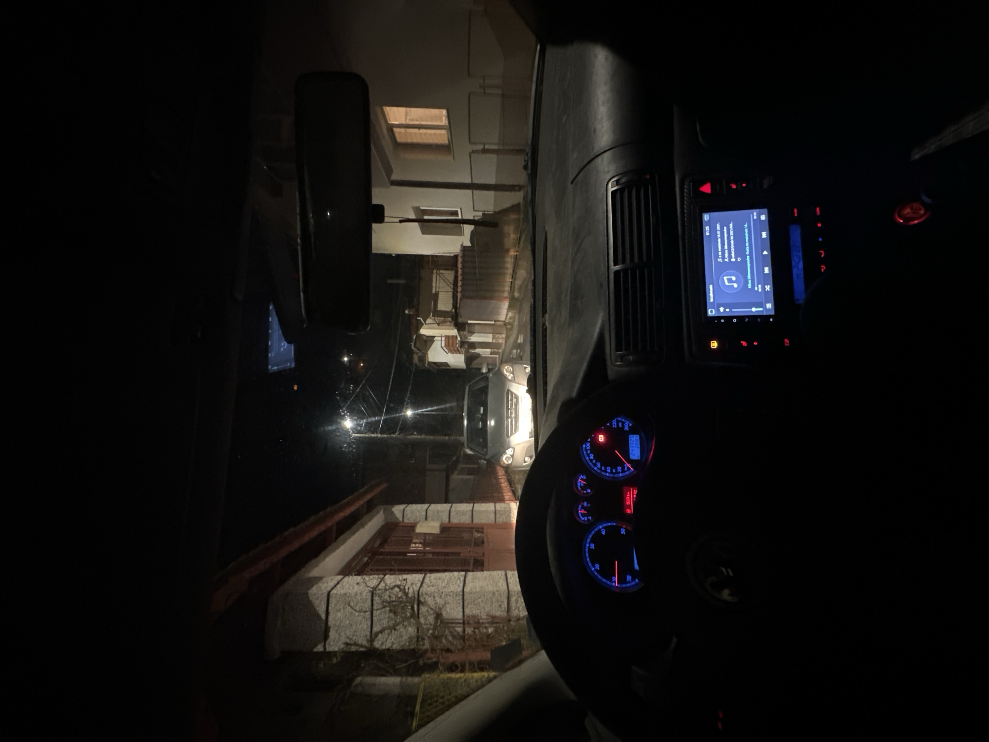 Vehicle navigates narrow street in Smolyan at night