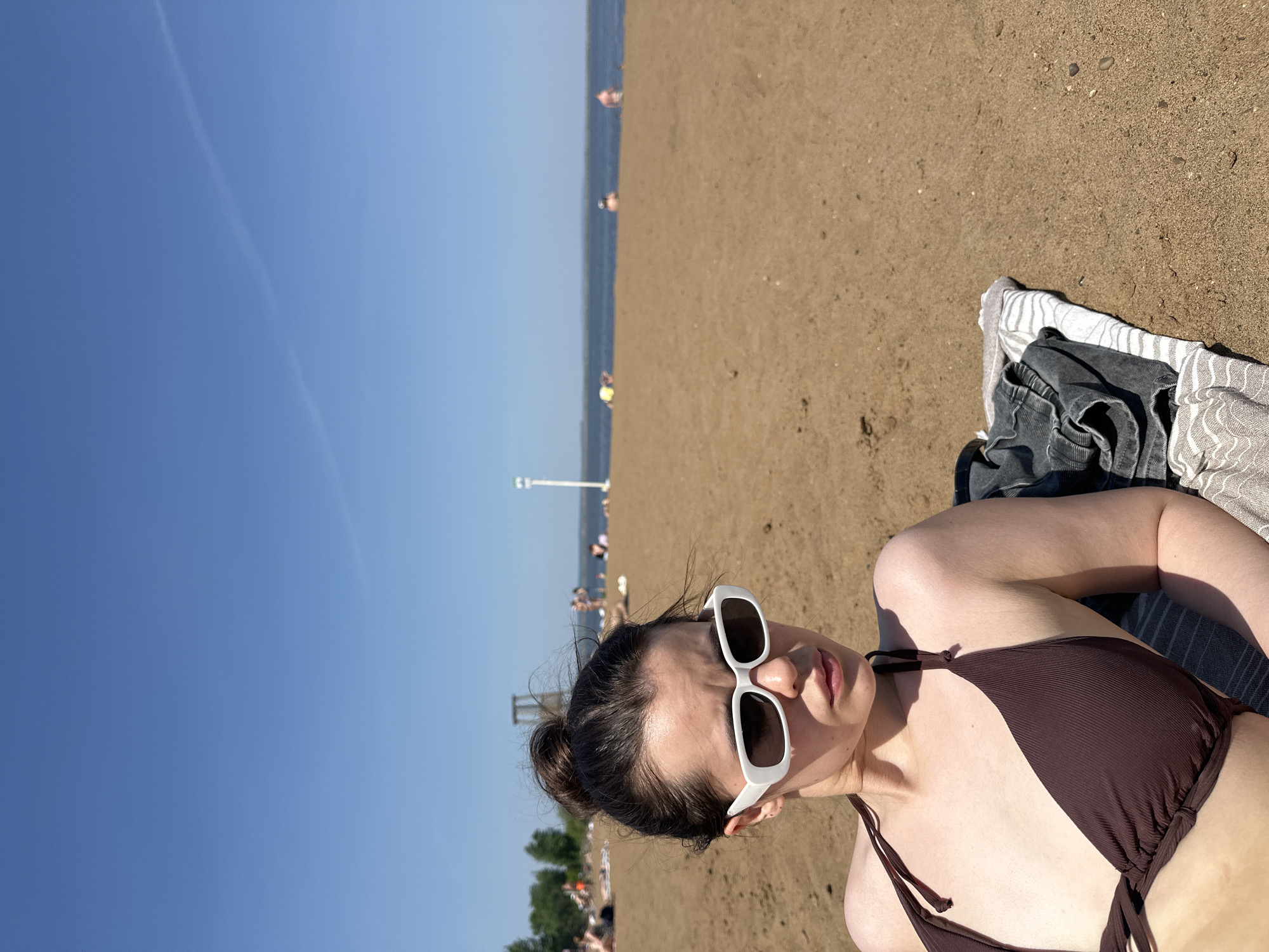 Woman photographed at multiple Chaikovsky waterfront locations over 13 minutes