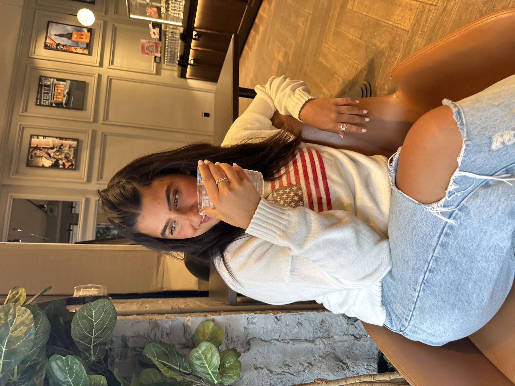 Woman photographed in modern NYC cafe Friday evening