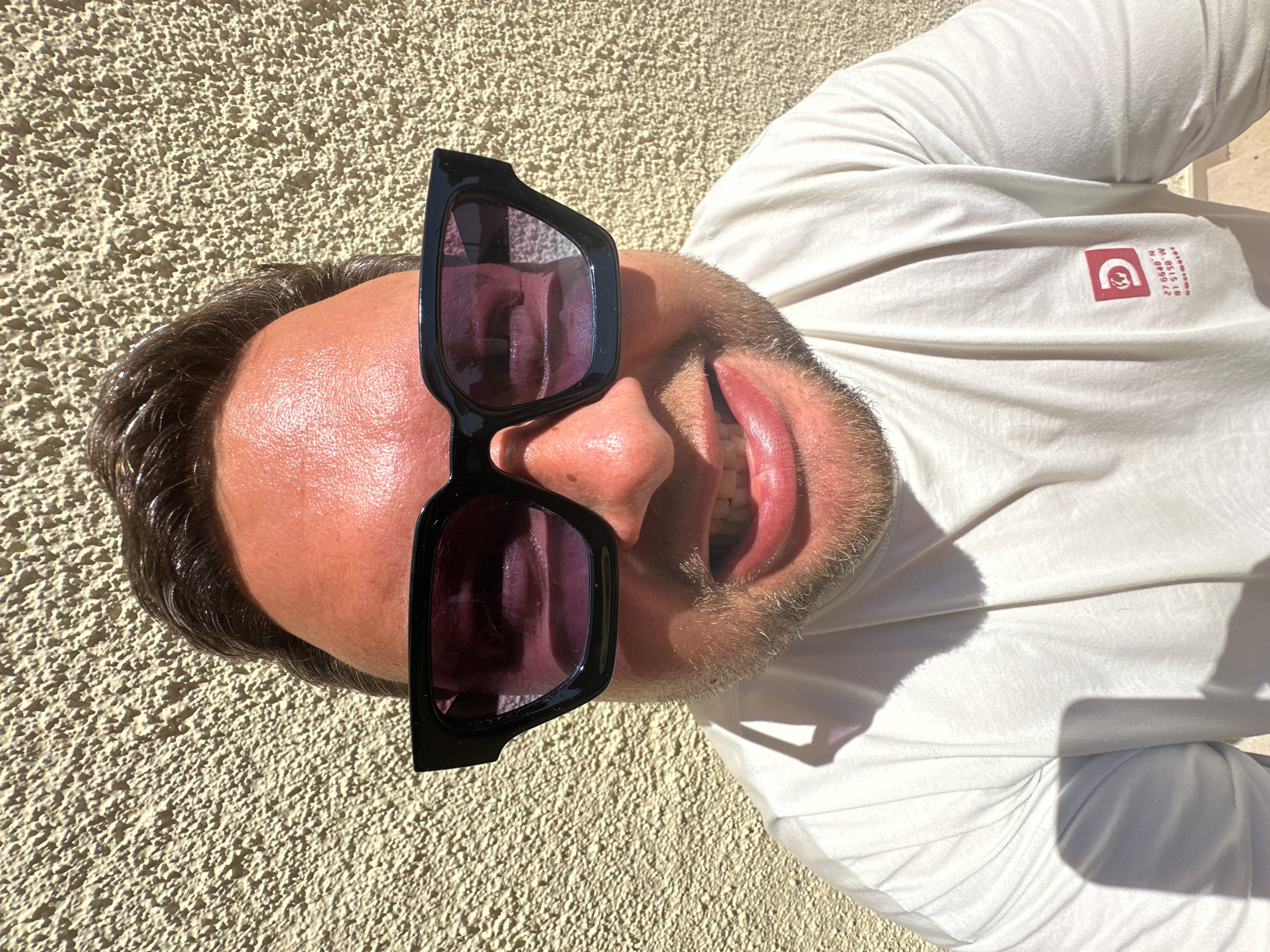 Man poses for eyewear social media content in Spanish coastal town