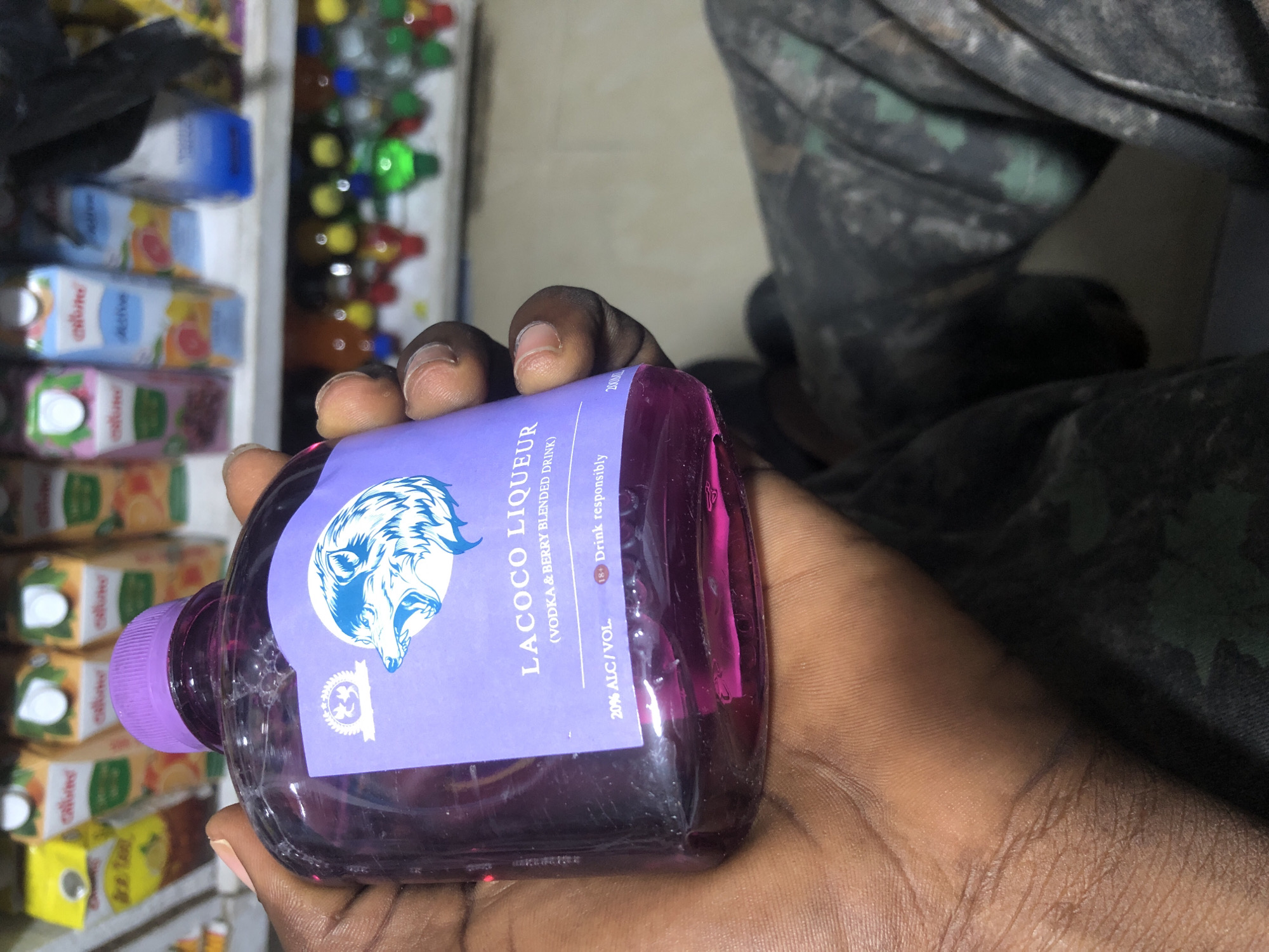 Browsing a packed convenience shop in Ado, Nigeria