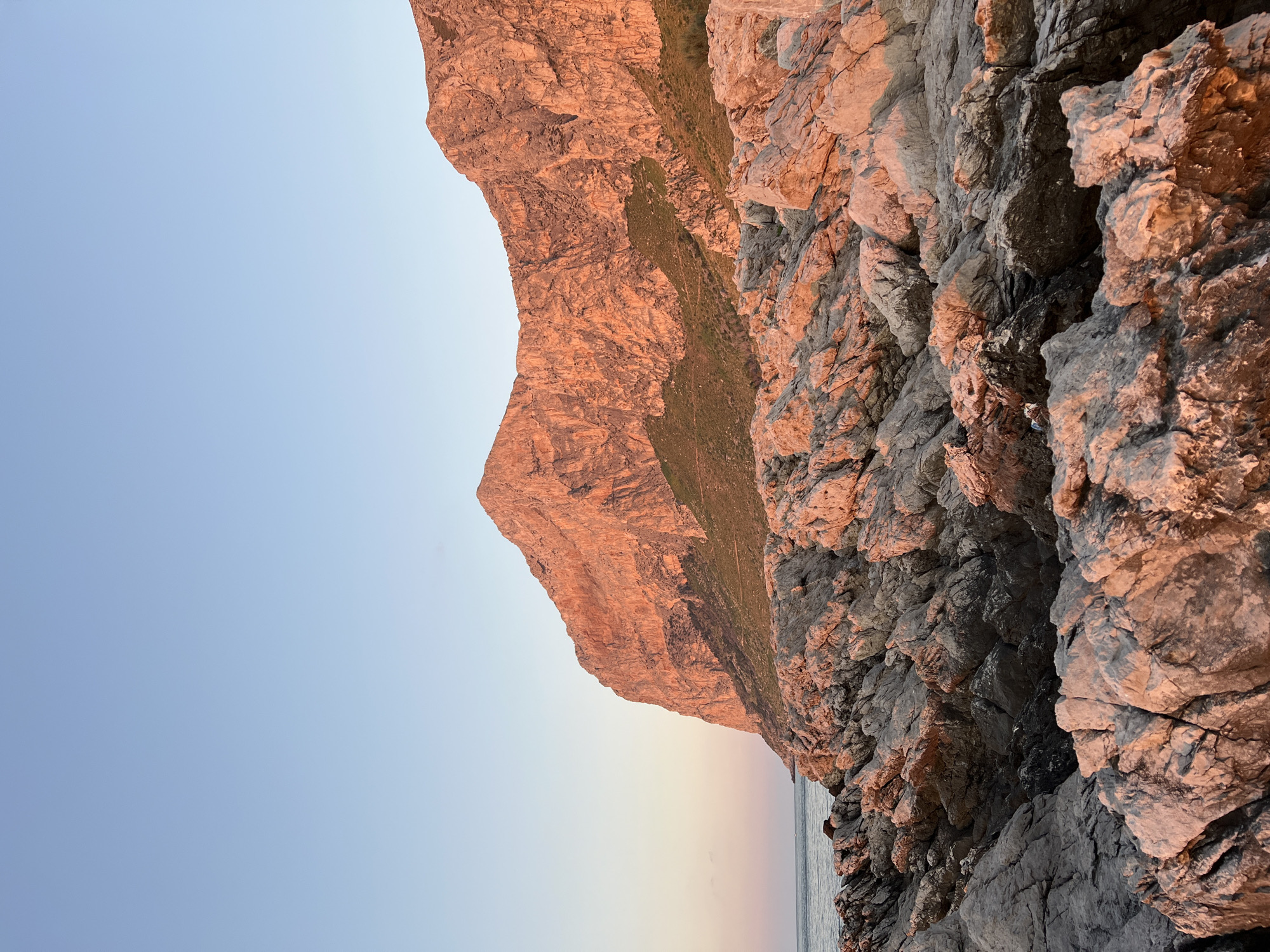 Sunset over a rocky Palermo coastline