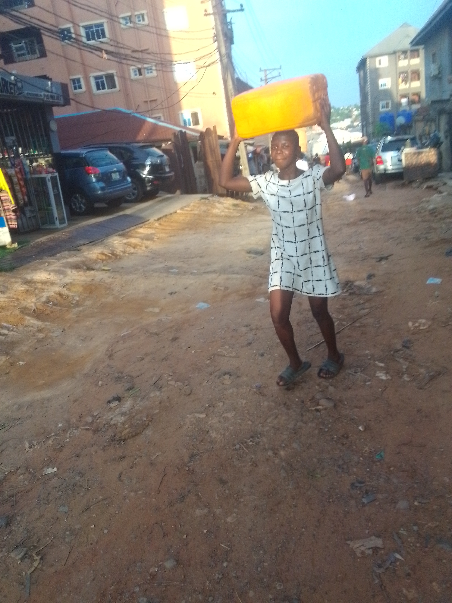 Daily life unfolds on dusty streets of Nkpor, Nigeria