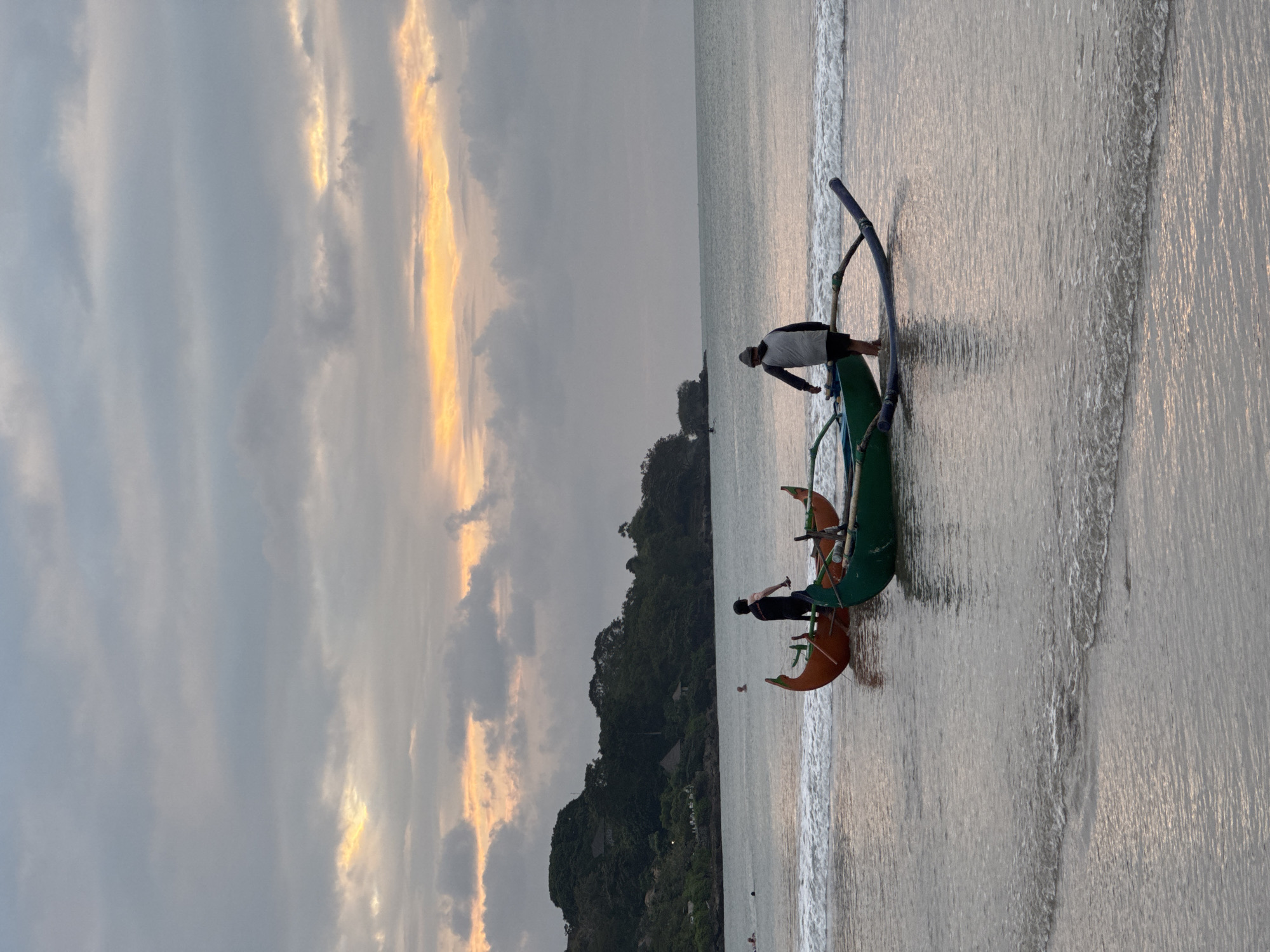 Sunset beach life in Kuta Selatan: horses, football, and fishing boats