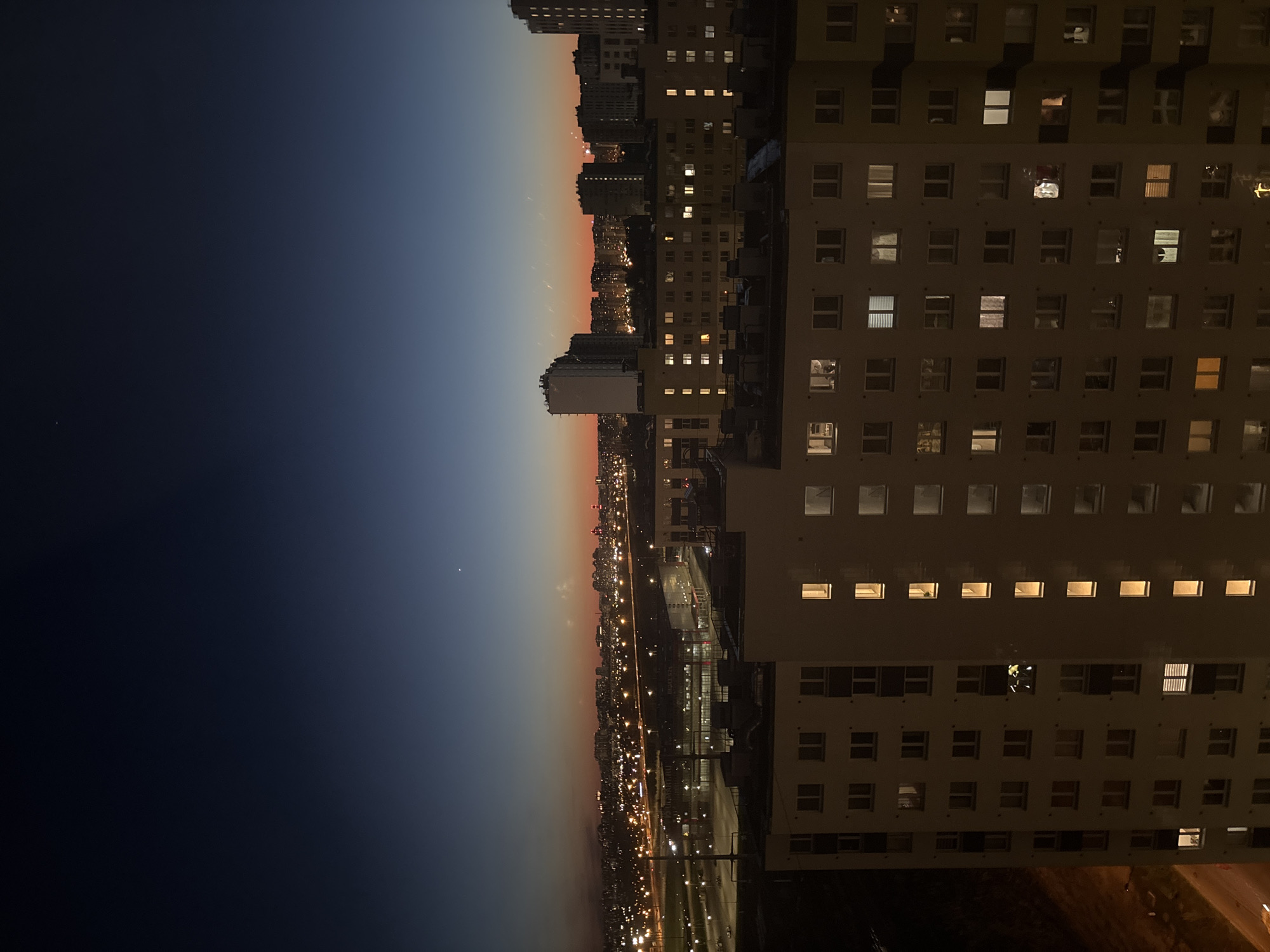 Evening lights illuminate apartment building in Vsevolozhsk, Russia