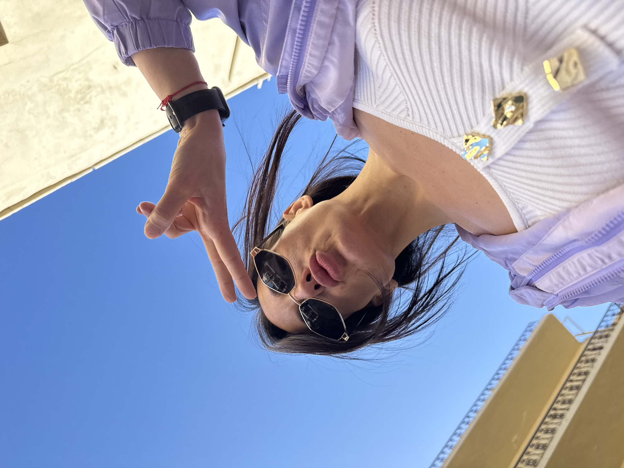 Woman takes selfie outside baby spa in Chania
