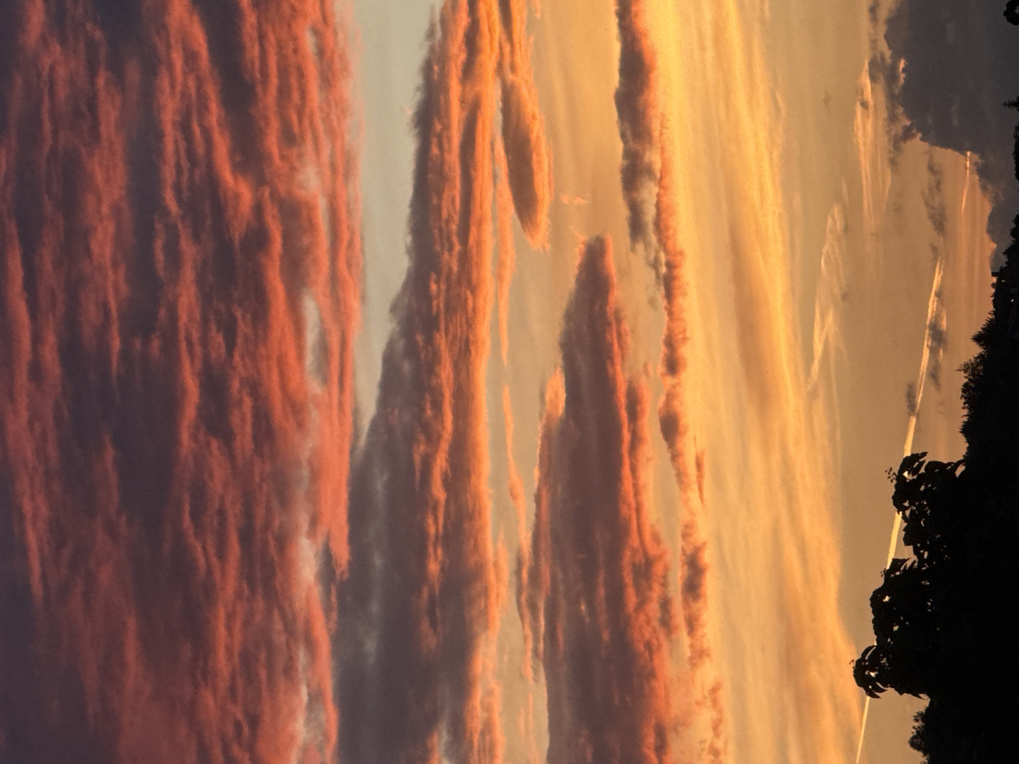 Vivid sunset clouds in purples, oranges, and pinks