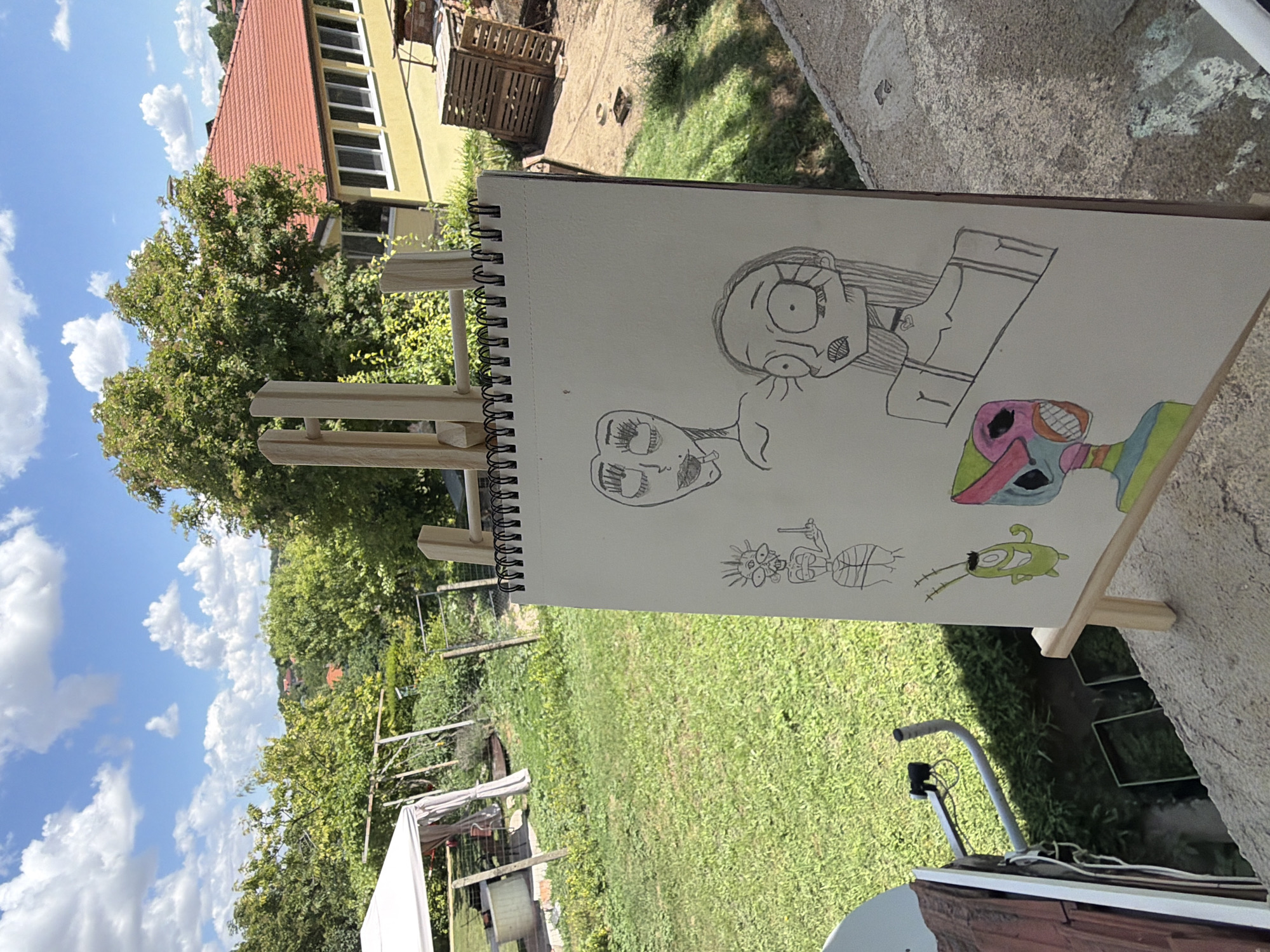Outdoor easels showcase chalk phrases and cartoon sketchbook art