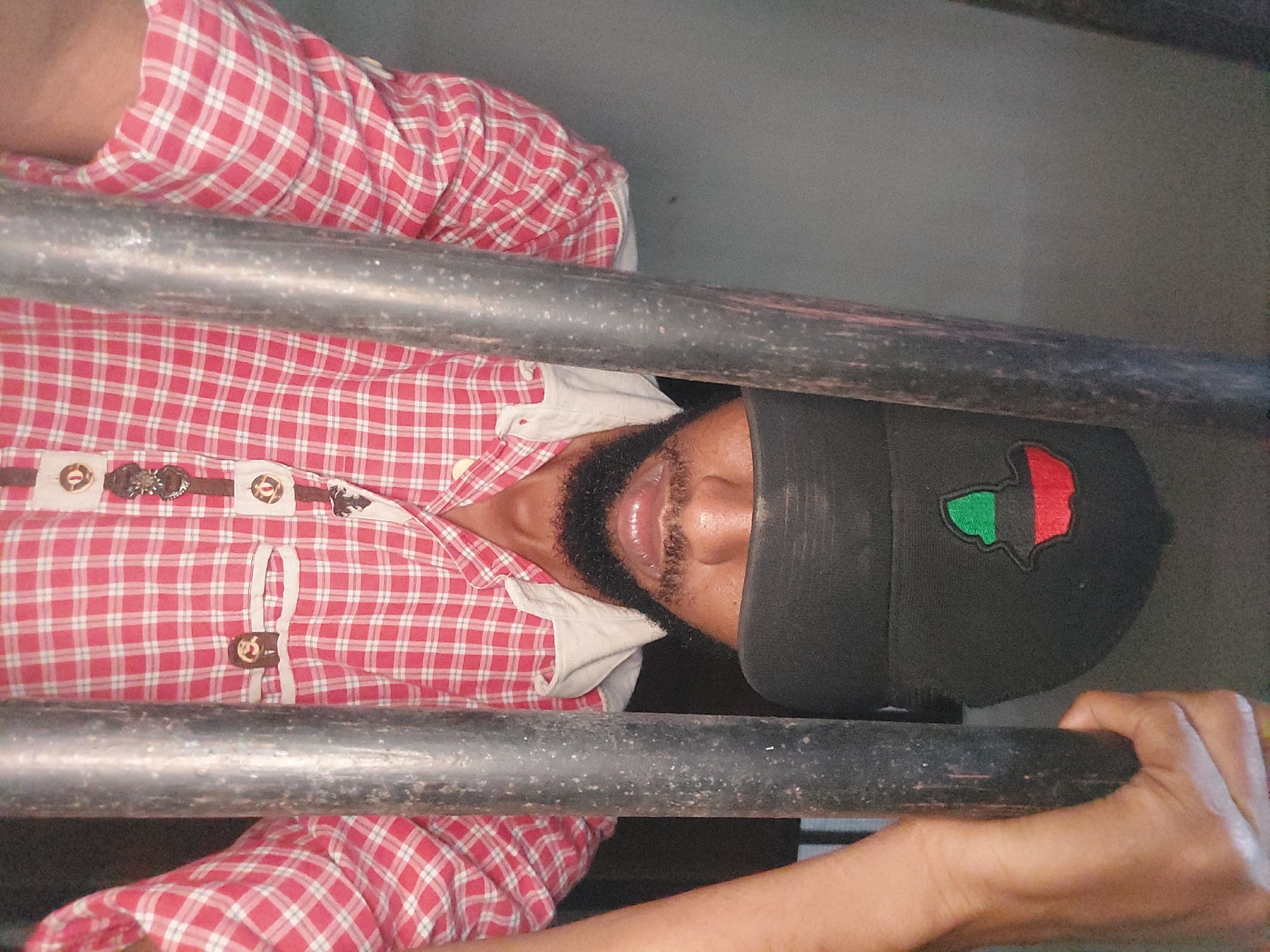 Bearded person in checkered shirt observed in Dar es-Salaam