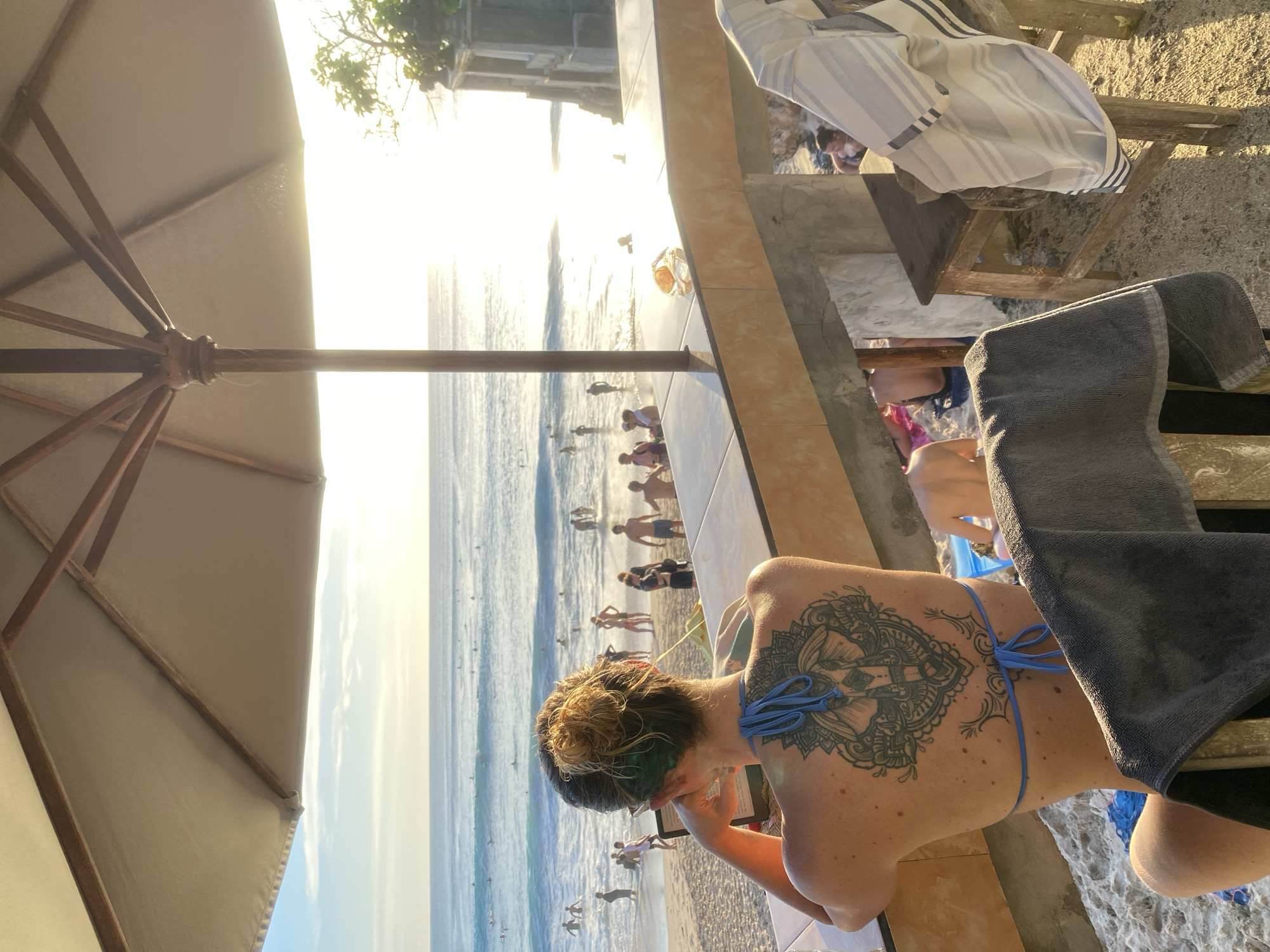 Beachgoers enjoy leisure time at Kuta Selatan coast