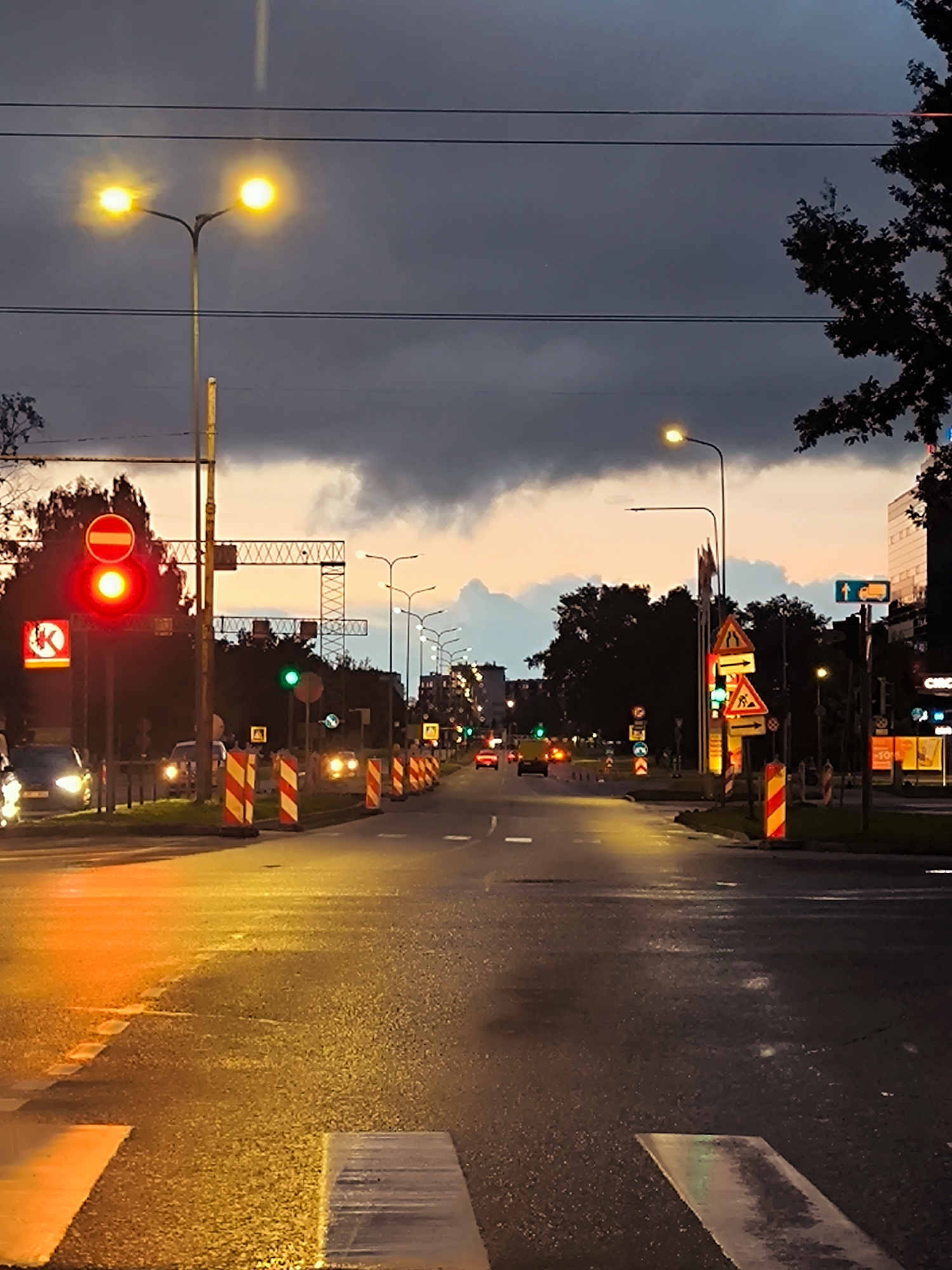 Riga street at twilight, pedestrian crossing in the foreground
