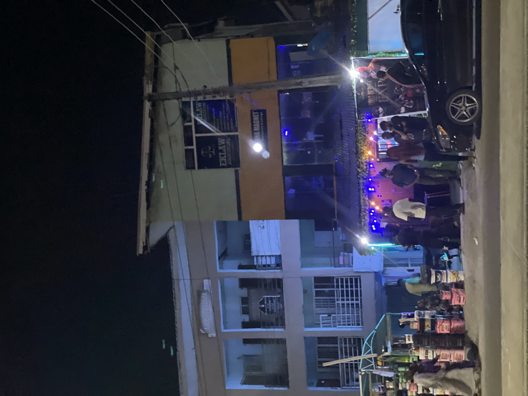 Evening street life documented in Ado, Nigeria commercial district