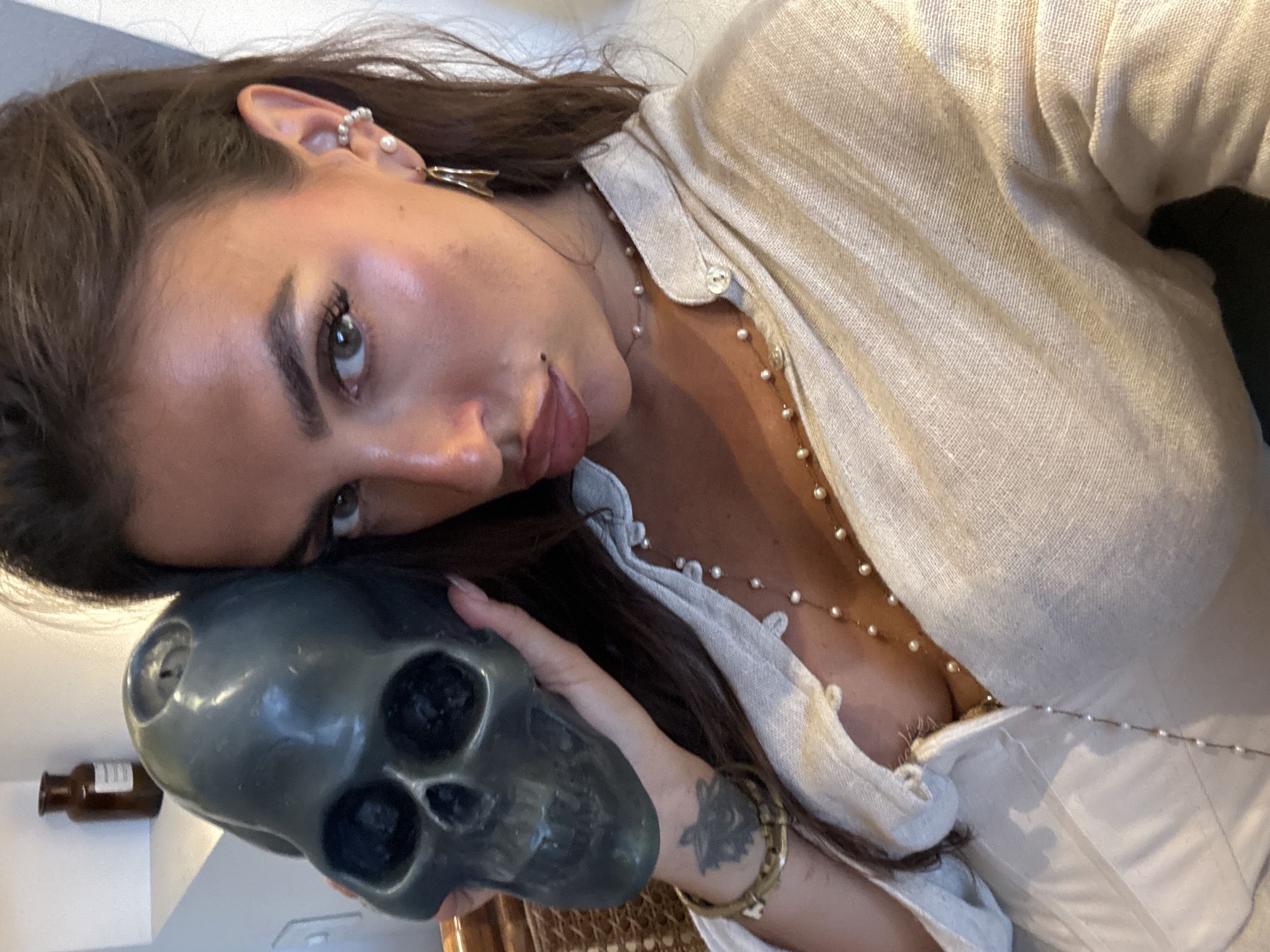 Woman poses with skull in multiple photos in North Kuta