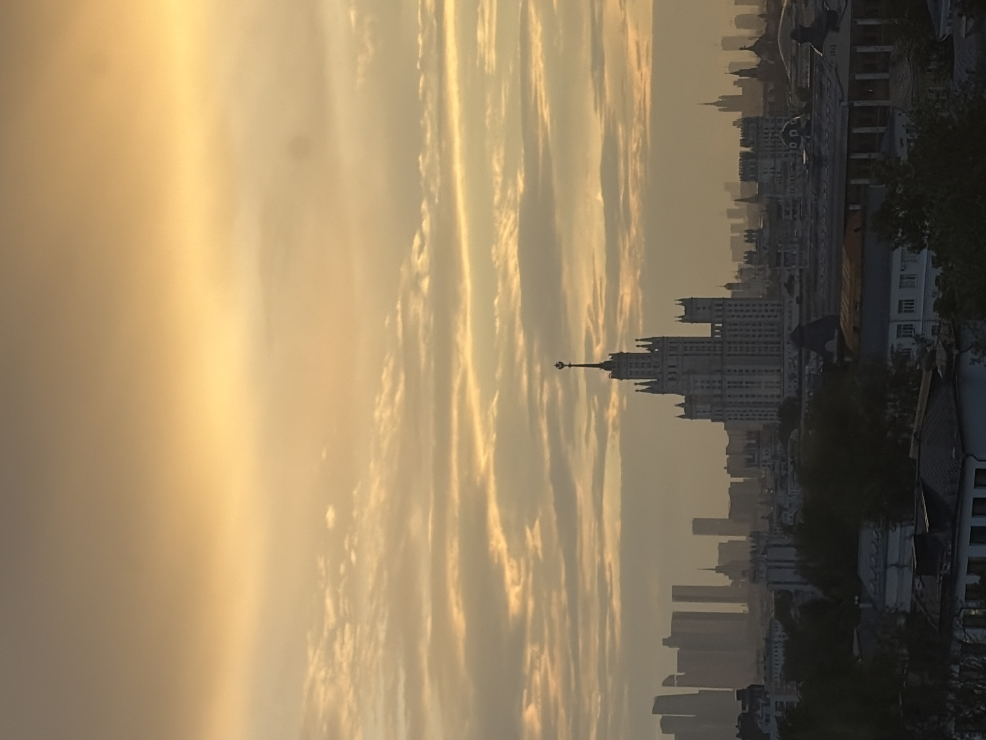 Moscow golden hour skyline meets quirky neon-lit interior display