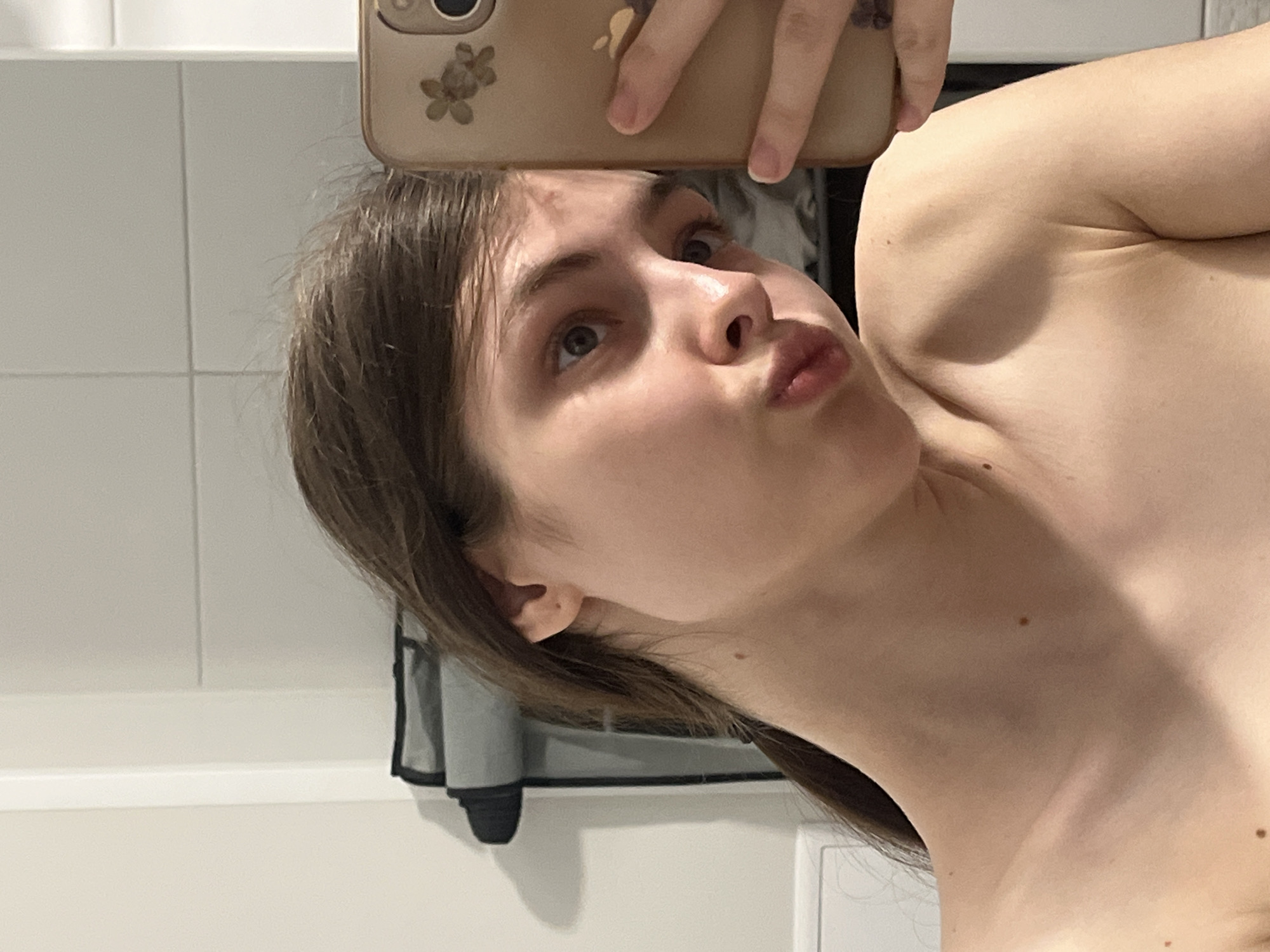 Woman takes mirror selfies in Saint Petersburg apartment