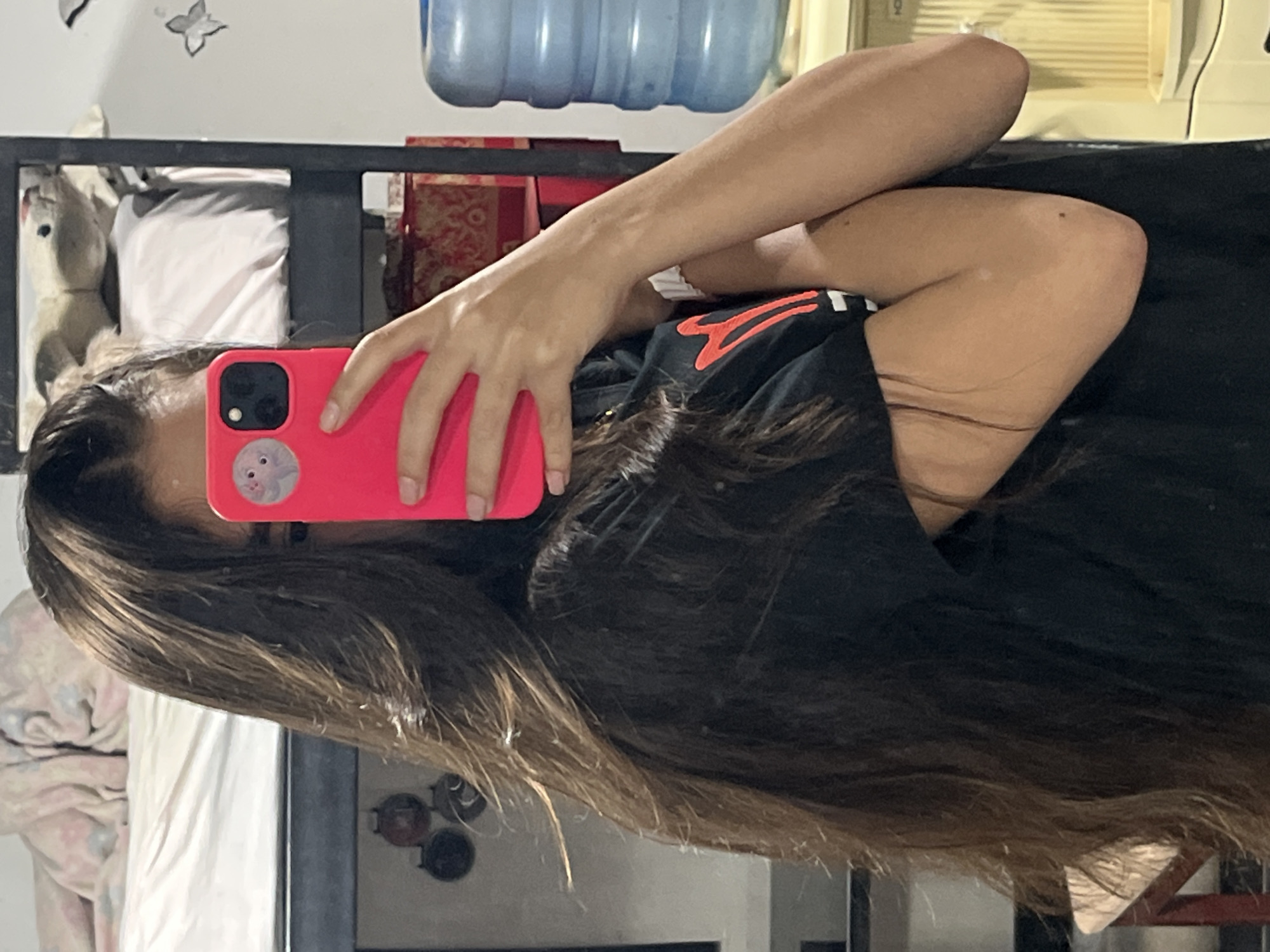 Selfie session in Juan Griego, Venezuela, pink phone in hand