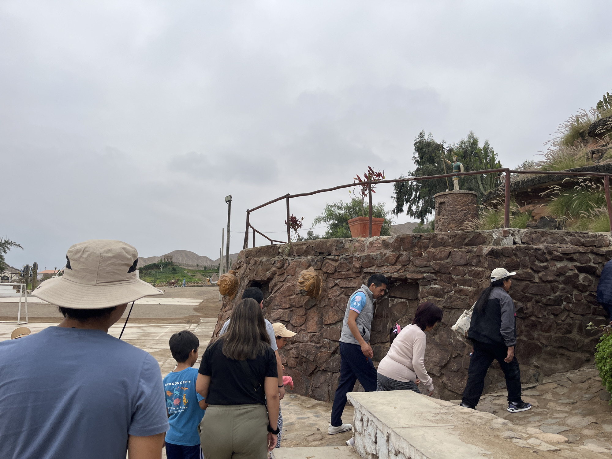 Families visit stone ruins in Quilmaná, Peru