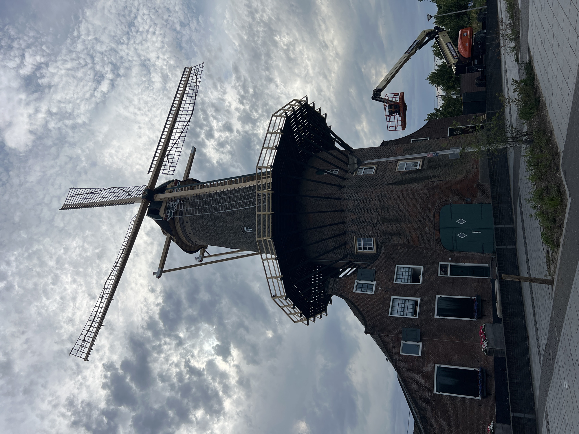 Windmill maintenance underway in Delft with cherry picker in action