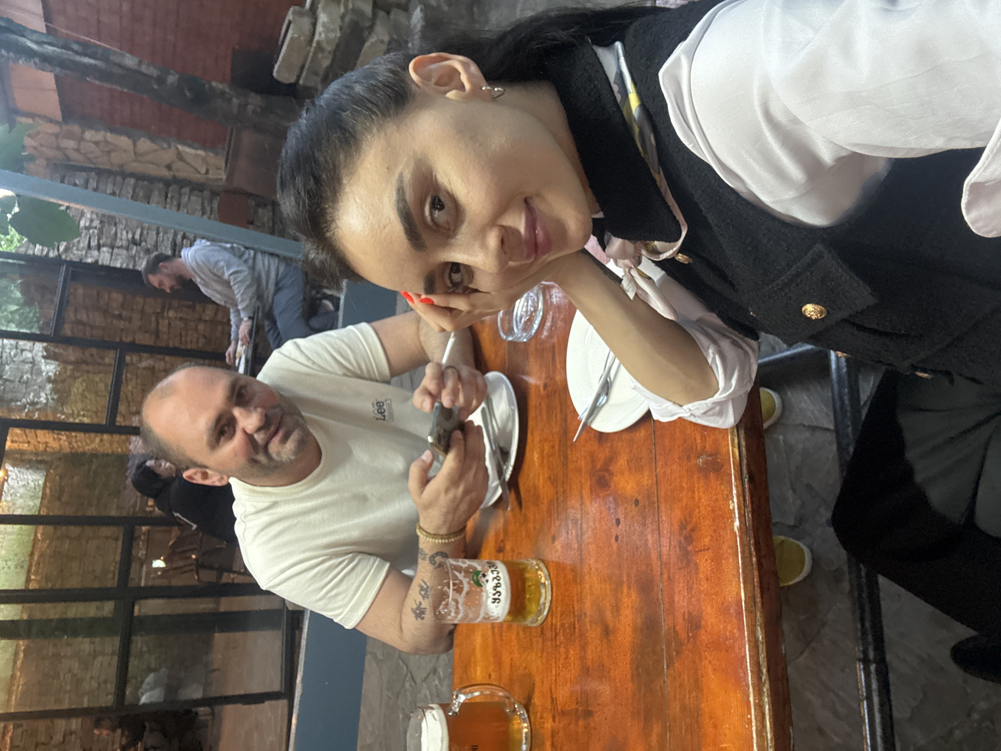 Woman documents casual dining experience in Tbilisi restaurant