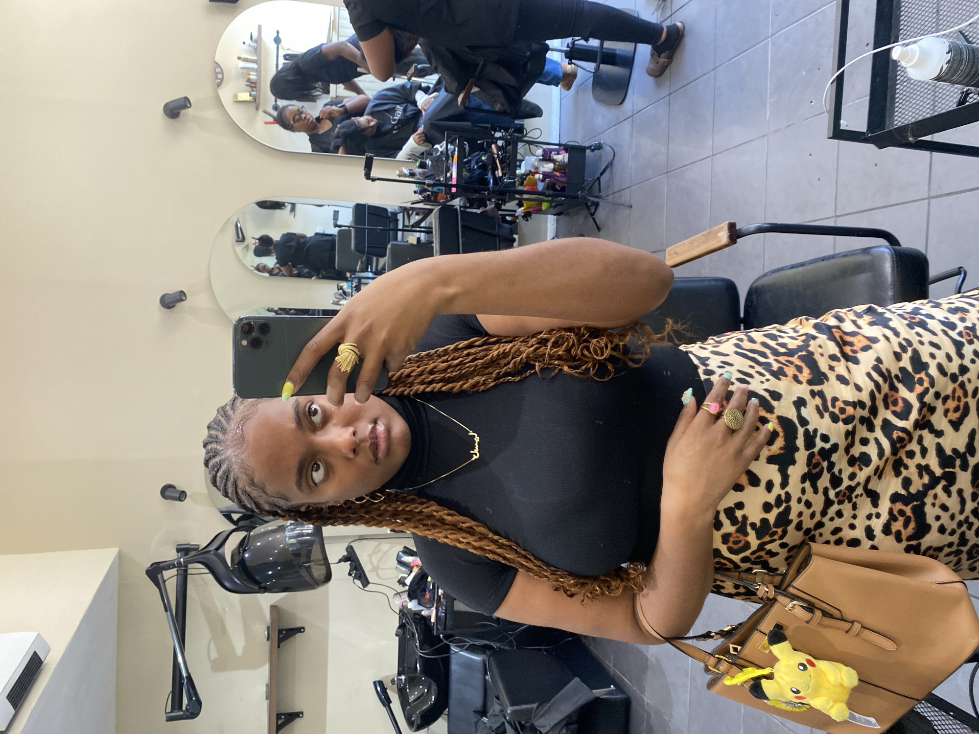 Woman takes selfie at London hair salon