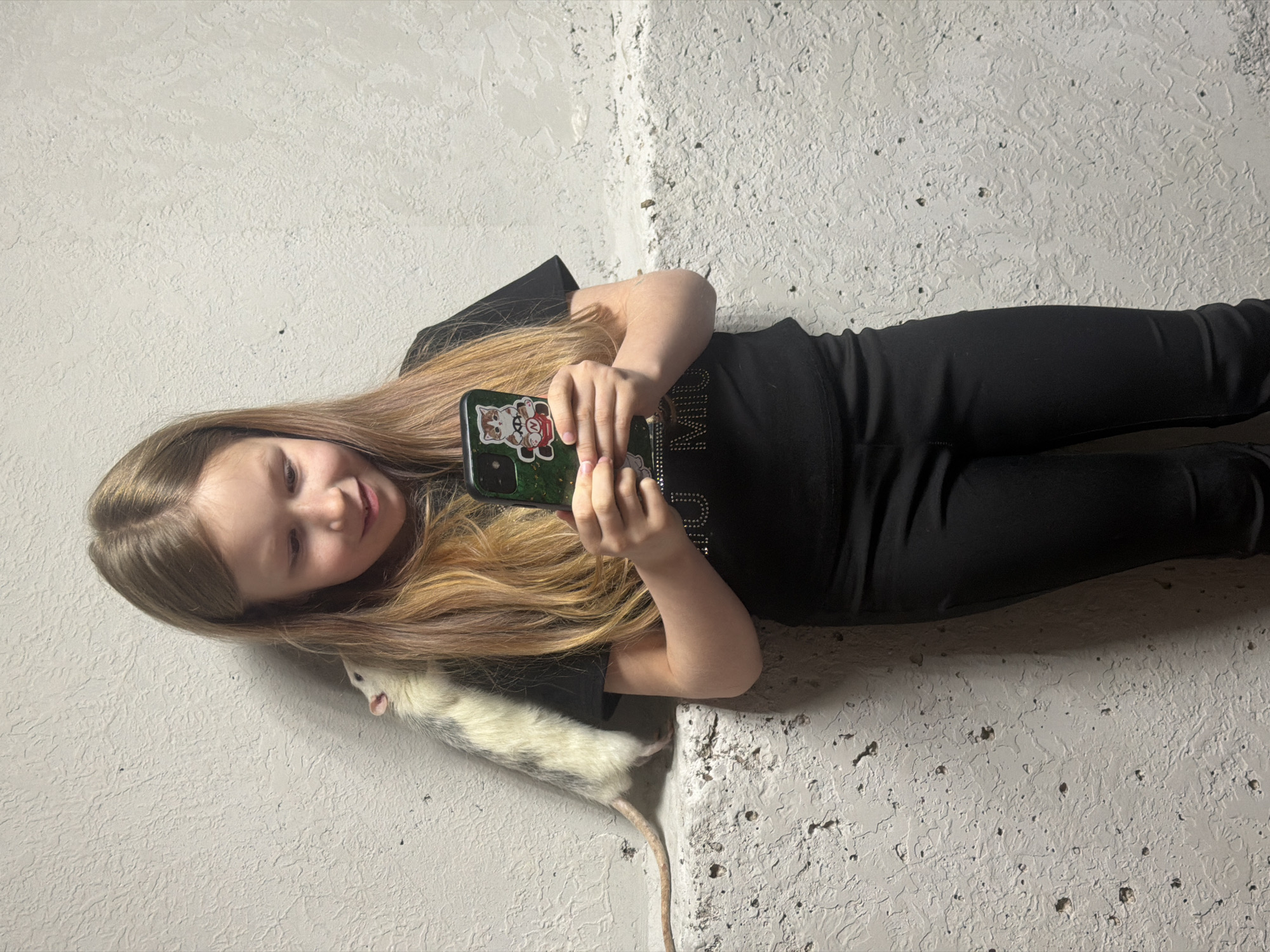 Girl plays with pet rats in Dubovaya home