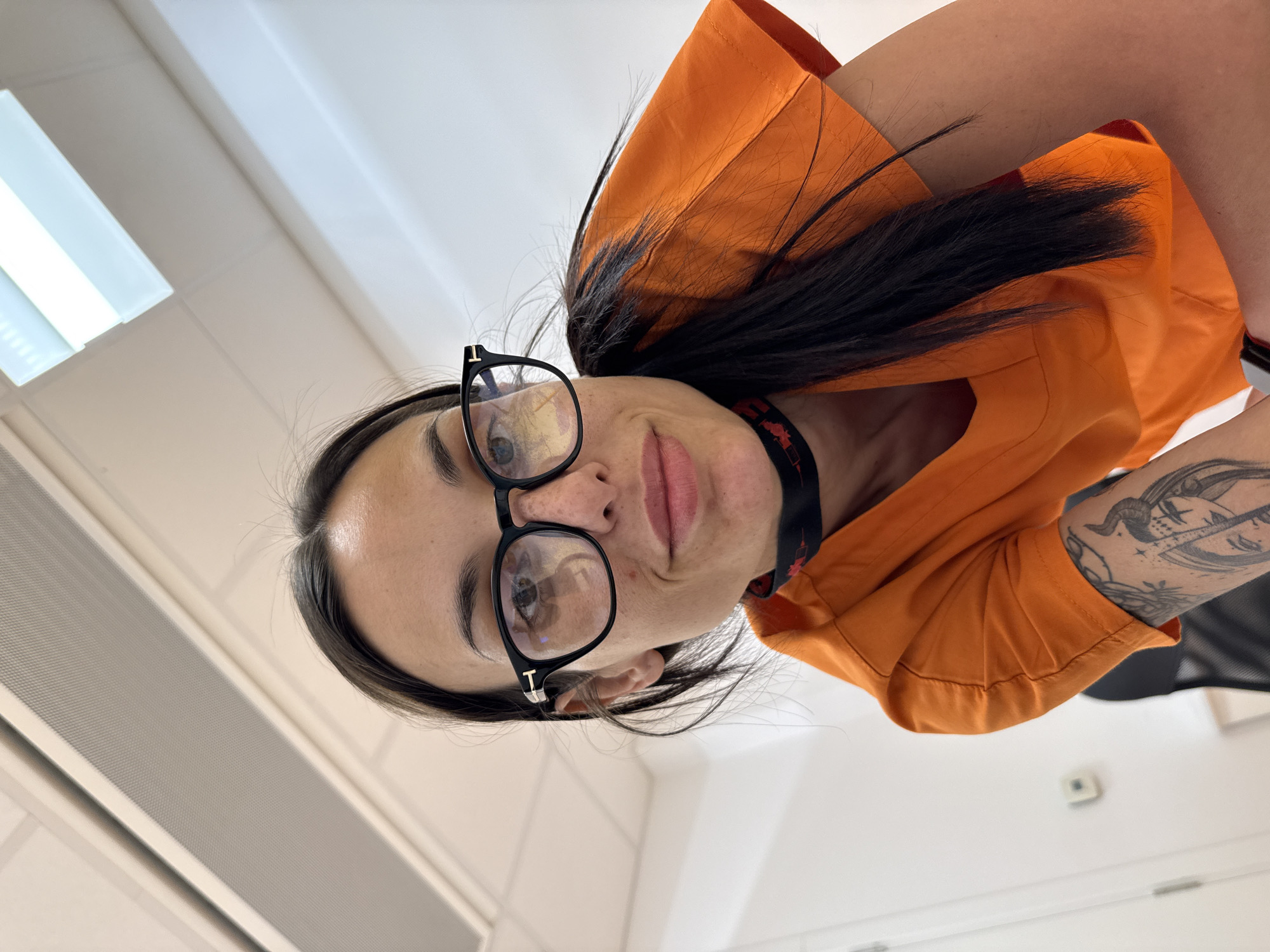Person in orange jacket observed indoors during early morning