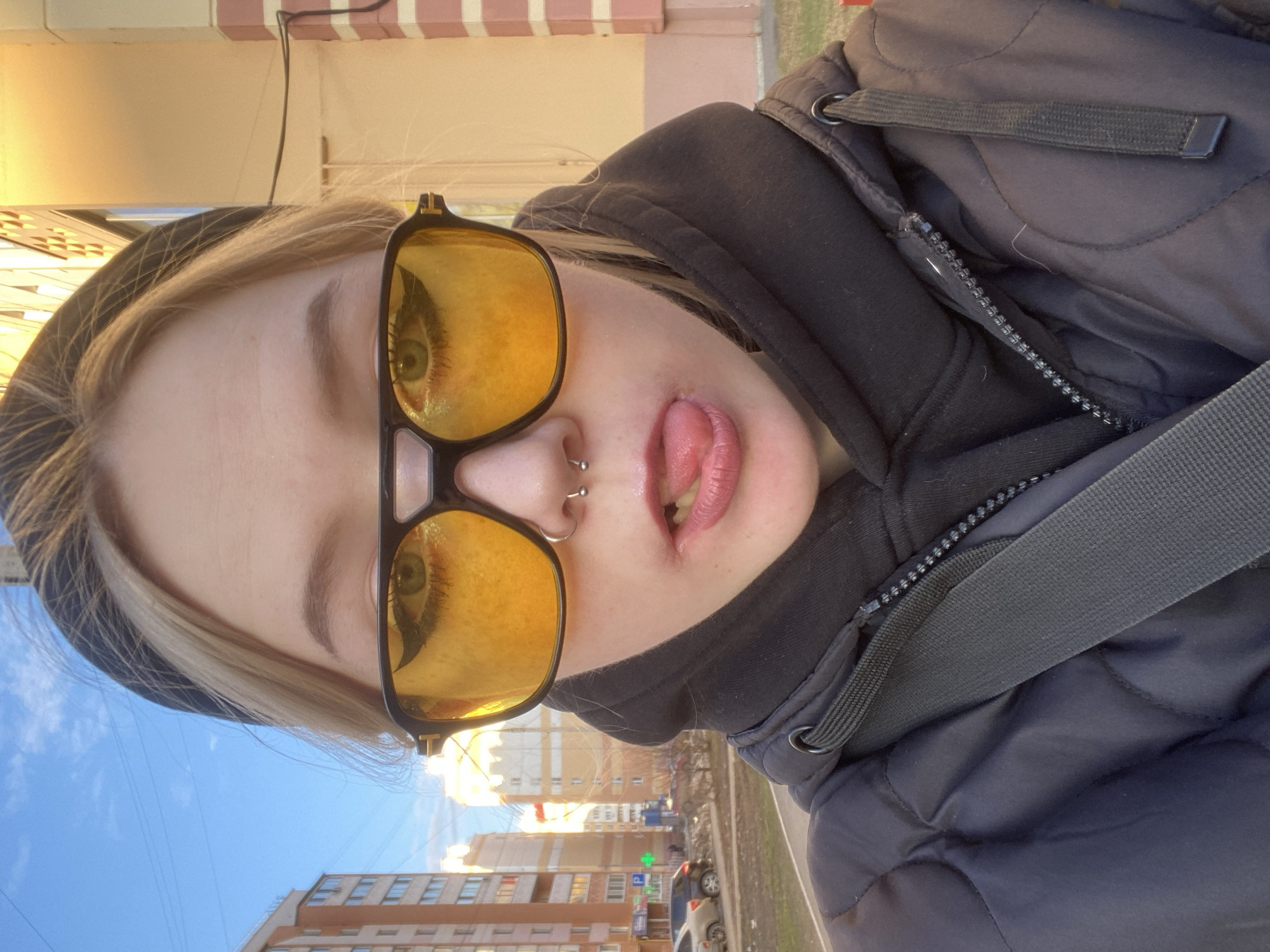 Person takes selfies in residential Izhevsk neighborhood