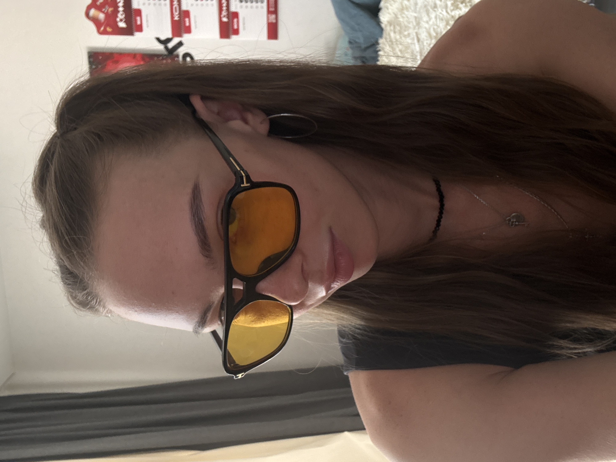 Woman takes indoor selfies, applies makeup during morning session