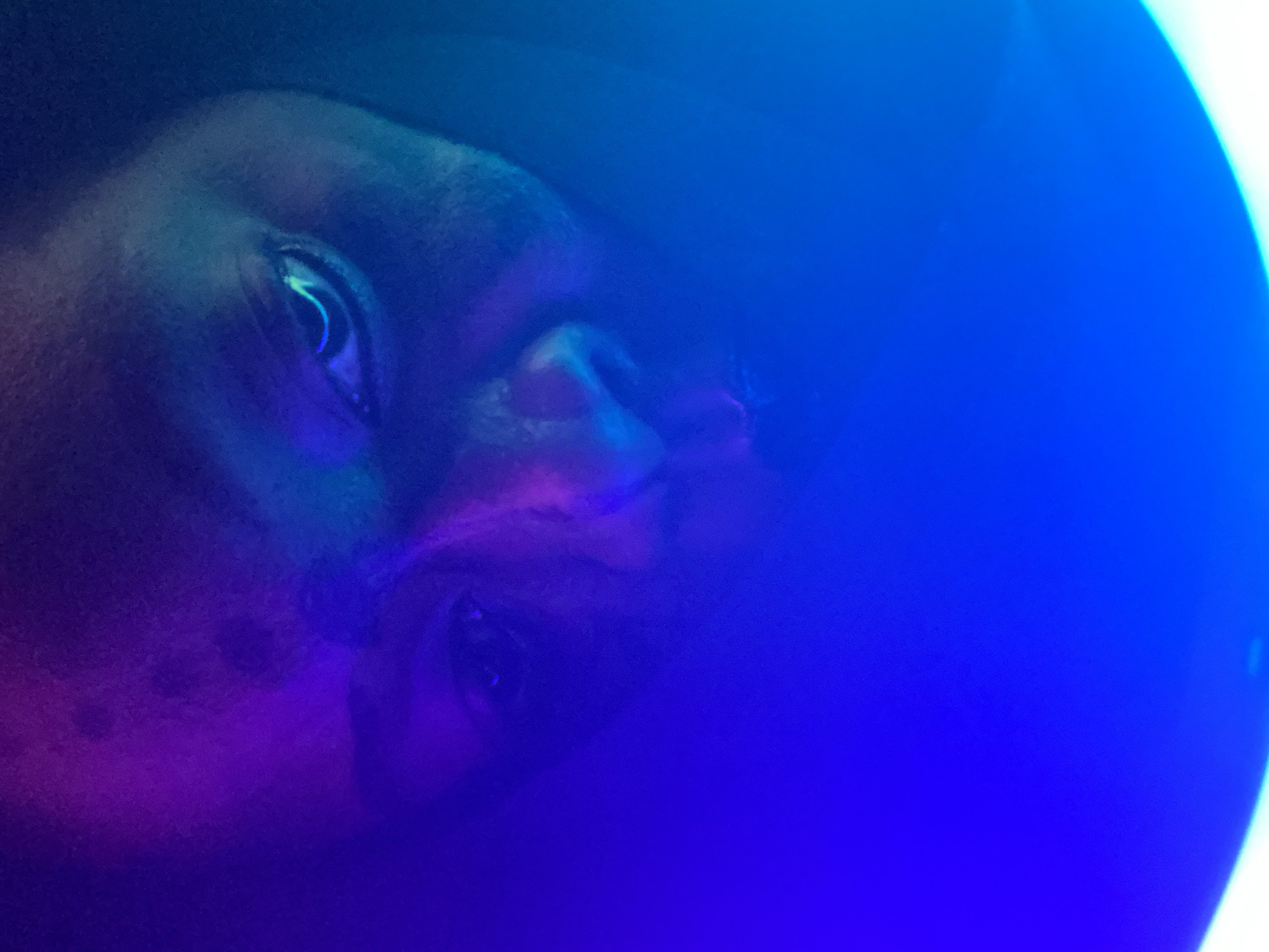 Person experiments with colorful ring lighting in Nigeria