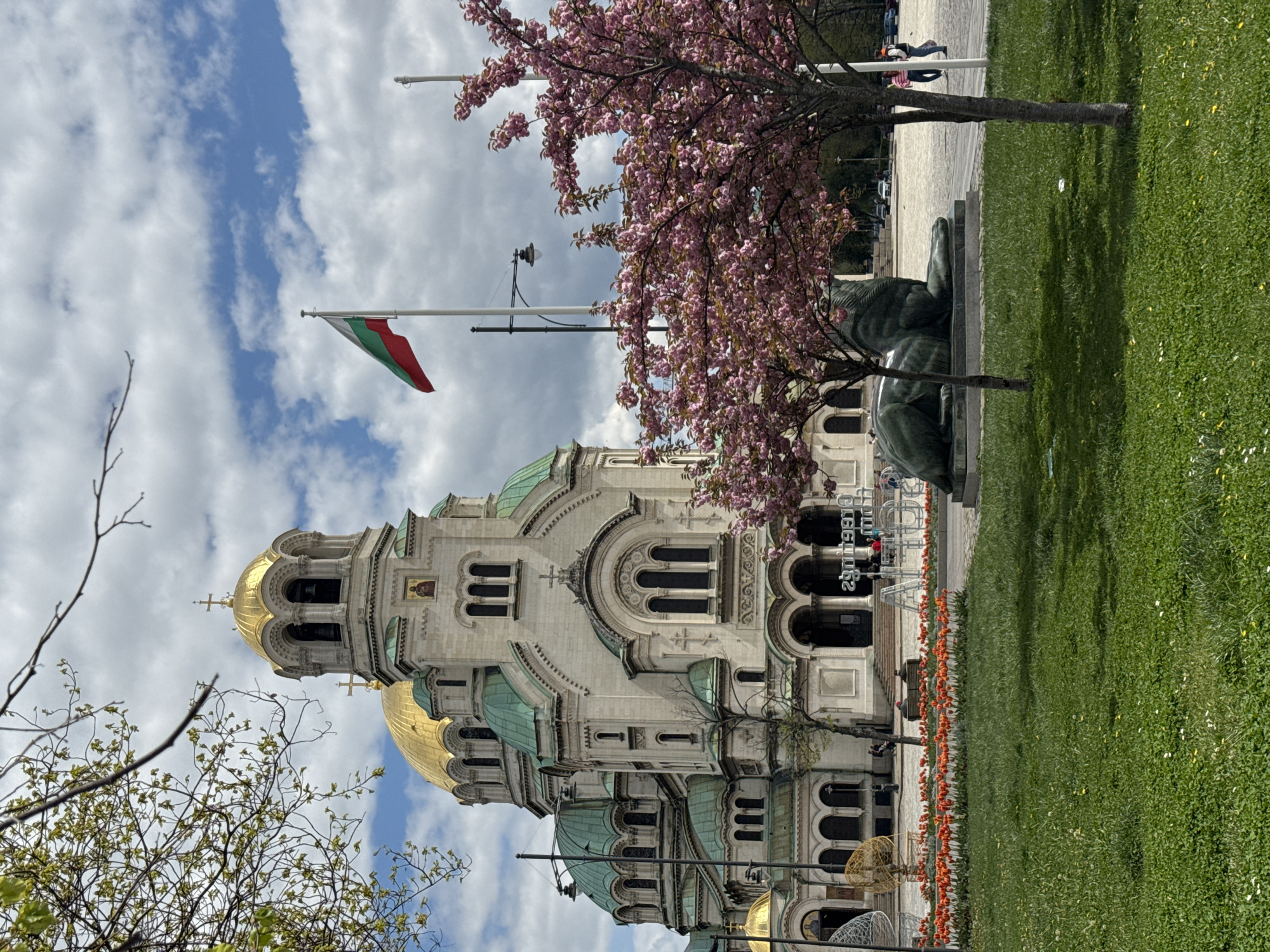 Spring blooms, pedestrians observed around Sofia's Alexander Nevsky Cathedral