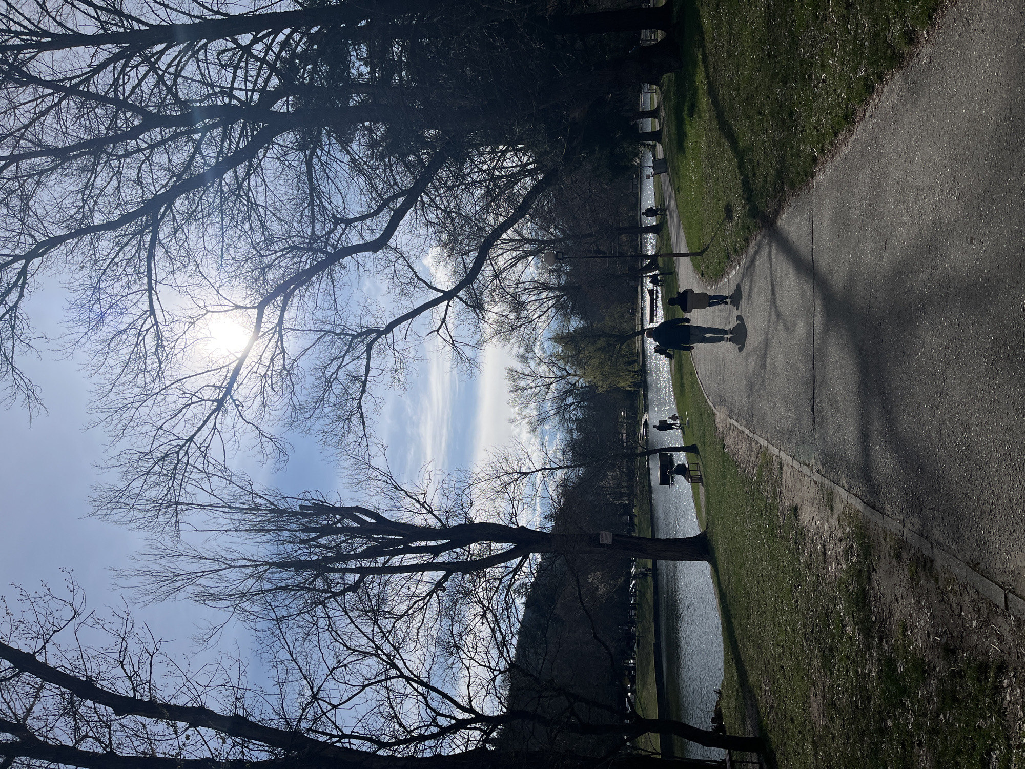 Afternoon park stroll captured along waterside pathway in Blagoevgrad