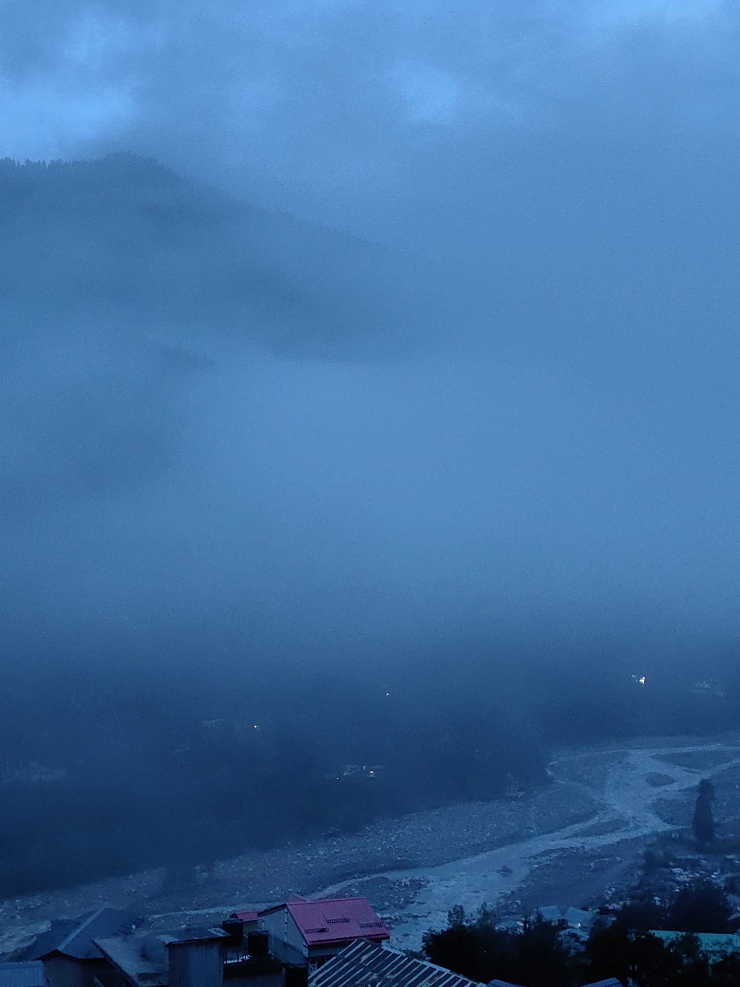 Vashisht village disappears into heavy evening fog and cloud
