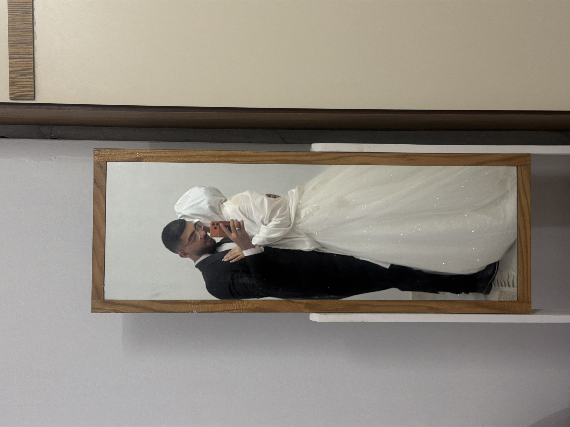 Wedding photo displayed on shelf in Gaza home