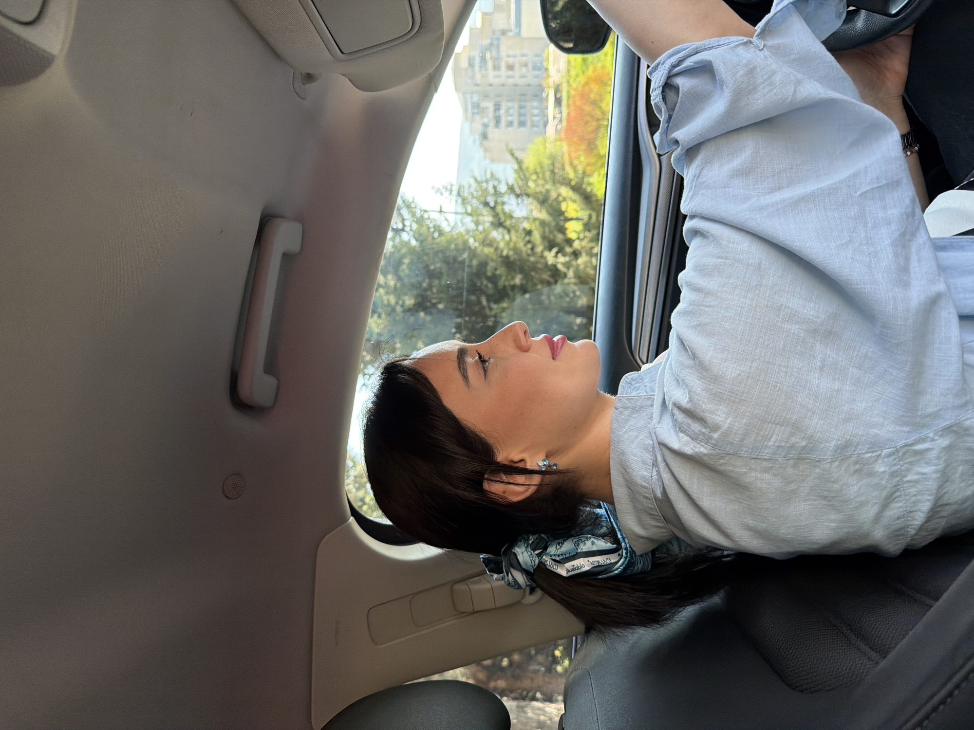 Two women photographed during car ride in Tbilisi